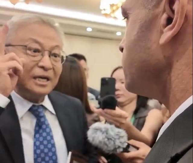 <p>Yan Xuetong, dean of the Institute of International Relations at Tsinghua University, confronts Elad Shoshan, the military attaché with the Israeli embassy in Beijing</p>