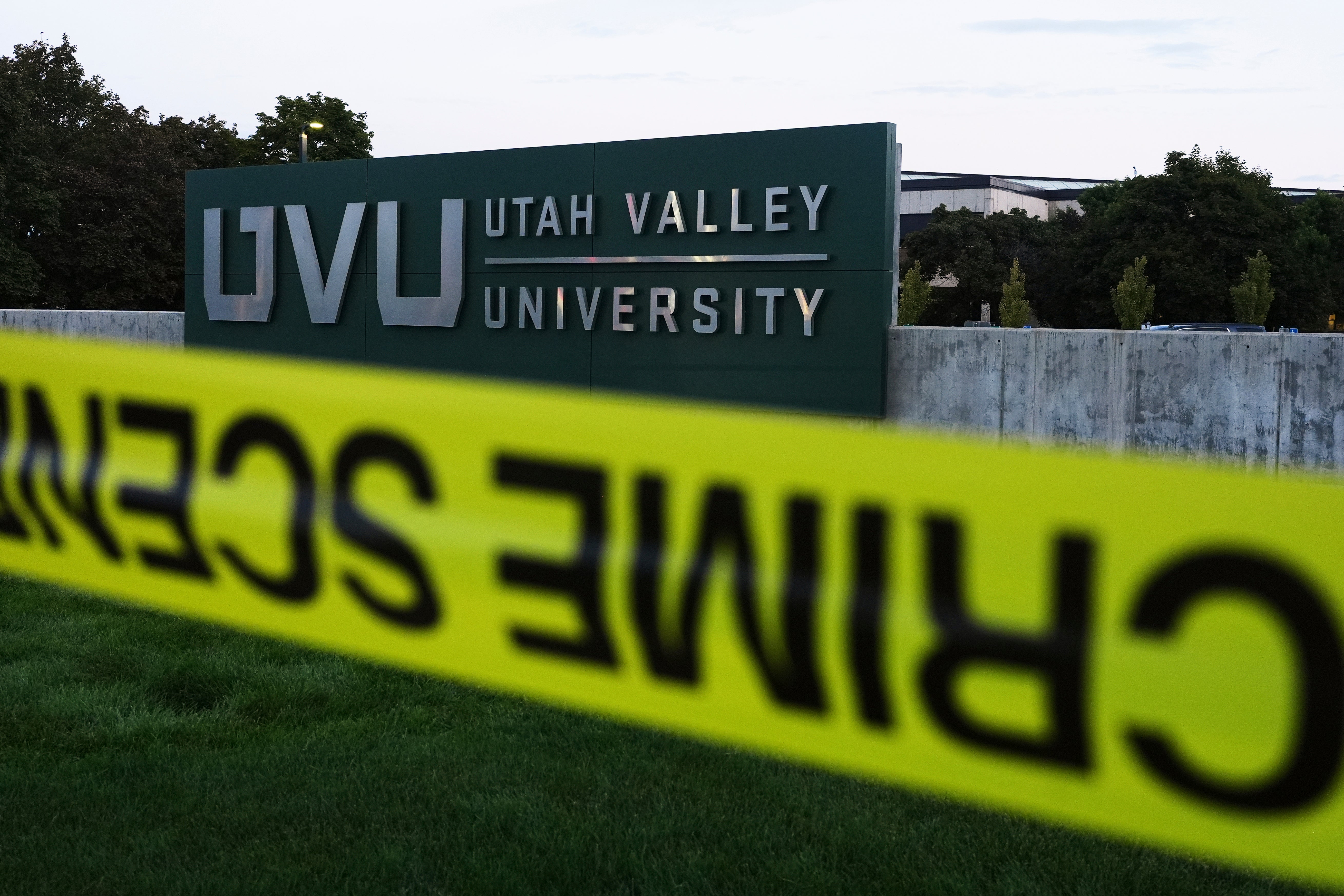 Crime scene tape surrounds Utah Valley University after Turning Point USA CEO and co-founder Charlie Kirk was shot and killed , Saturday, Sept. 13, 2025, in Orem, Utah. (AP Photo/Lindsey Wasson)