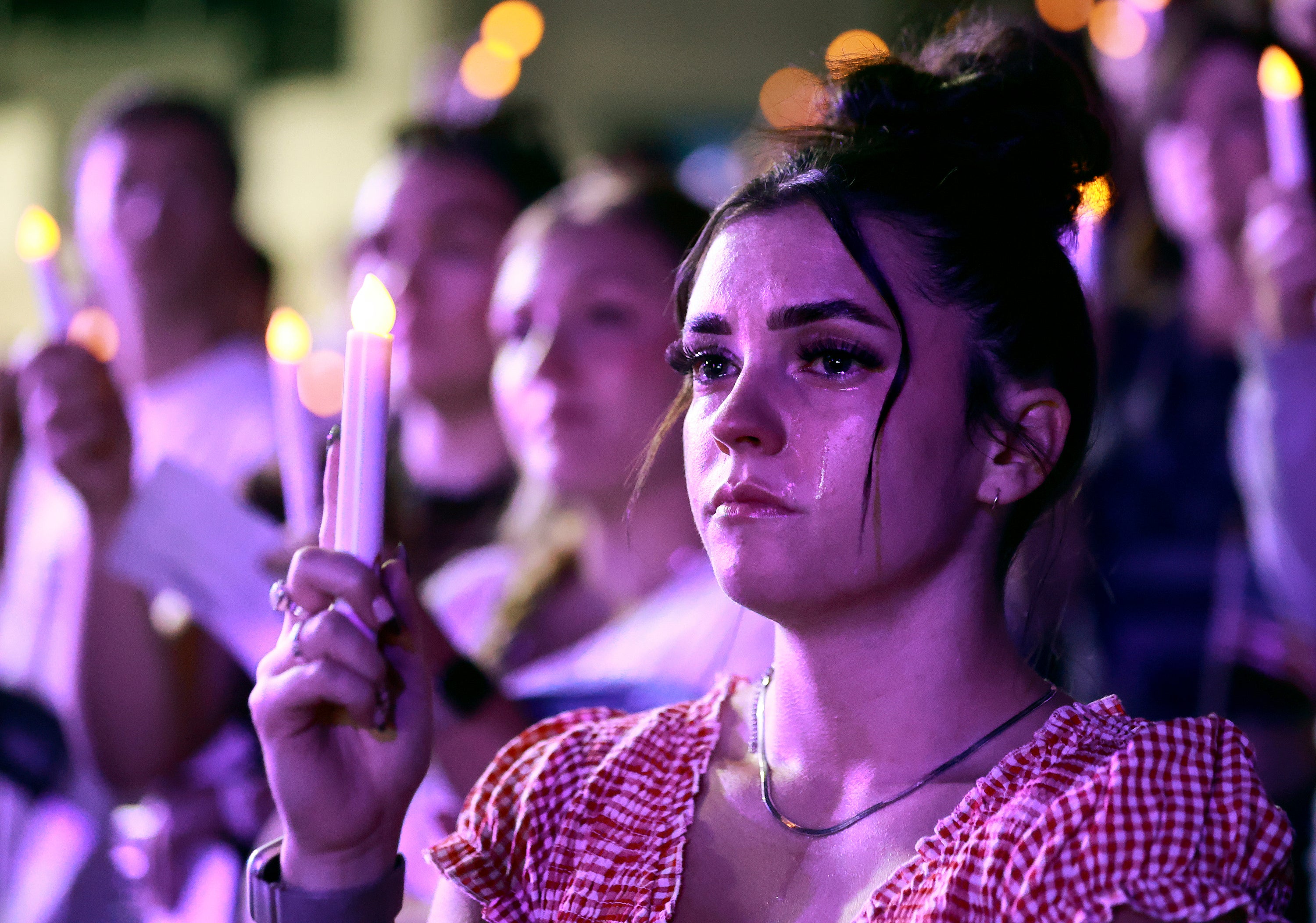 Tears stream down Alexa Maliwauki's face as she attends a Vigil for Unity at the UCCU Center at Utah Valley University in Orem on Friday, Sept. 19, 2025. Charlie Kirk, conservative activist and the founder and president of Turning Point USA, was fatally shot while answering questions at his American Comeback Tour at UVU on Sept. 10. (Kristin Murphy/The Deseret News via AP)