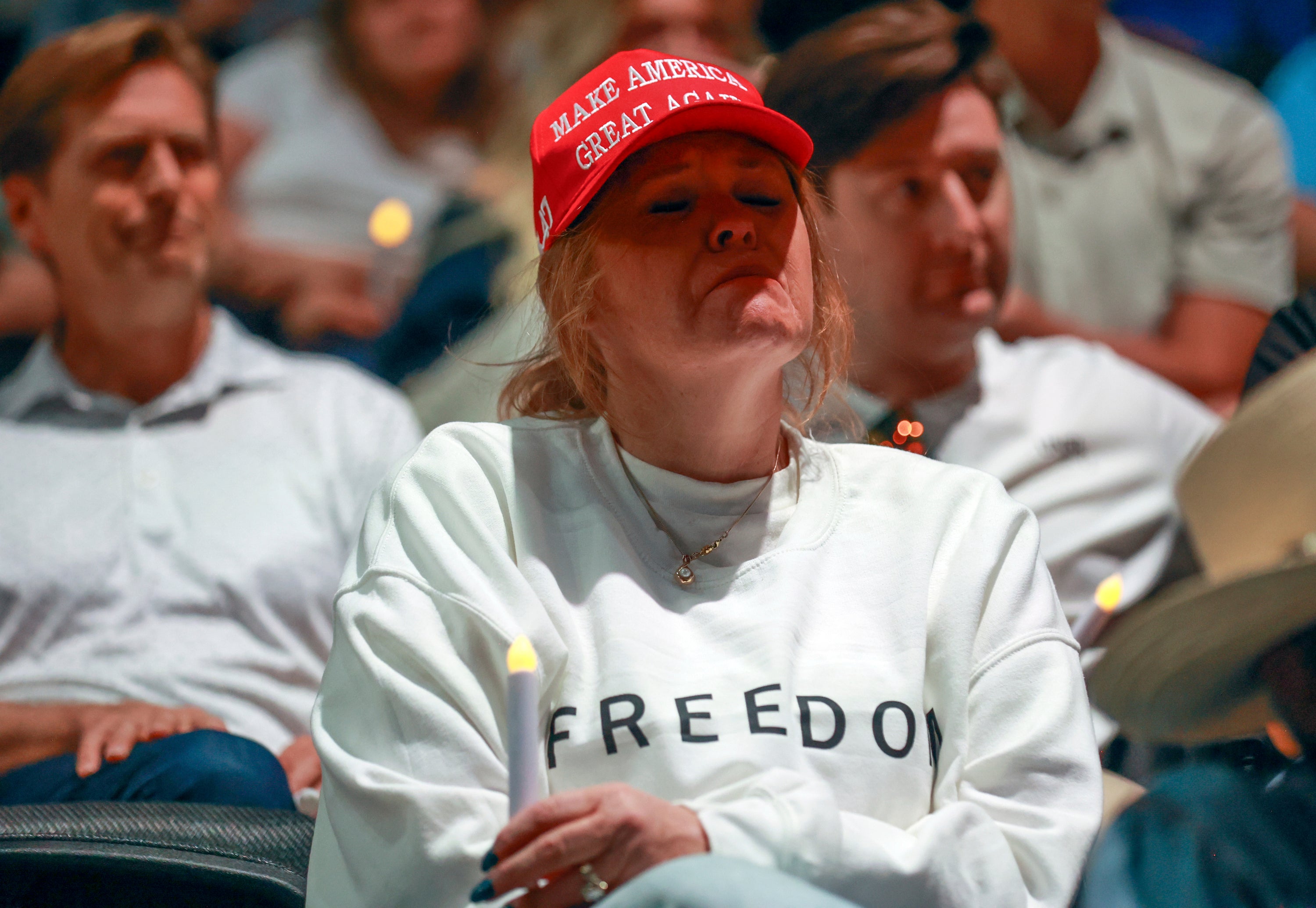Tori Merrill gets emotional during a Vigil for Unity at the UCCU Center at Utah Valley University in Orem on Friday, Sept. 19, 2025. Charlie Kirk, conservative activist and the founder and president of Turning Point USA, was fatally shot while answering questions at his American Comeback Tour at UVU on Sept. 10. (Kristin Murphy/The Deseret News via AP)