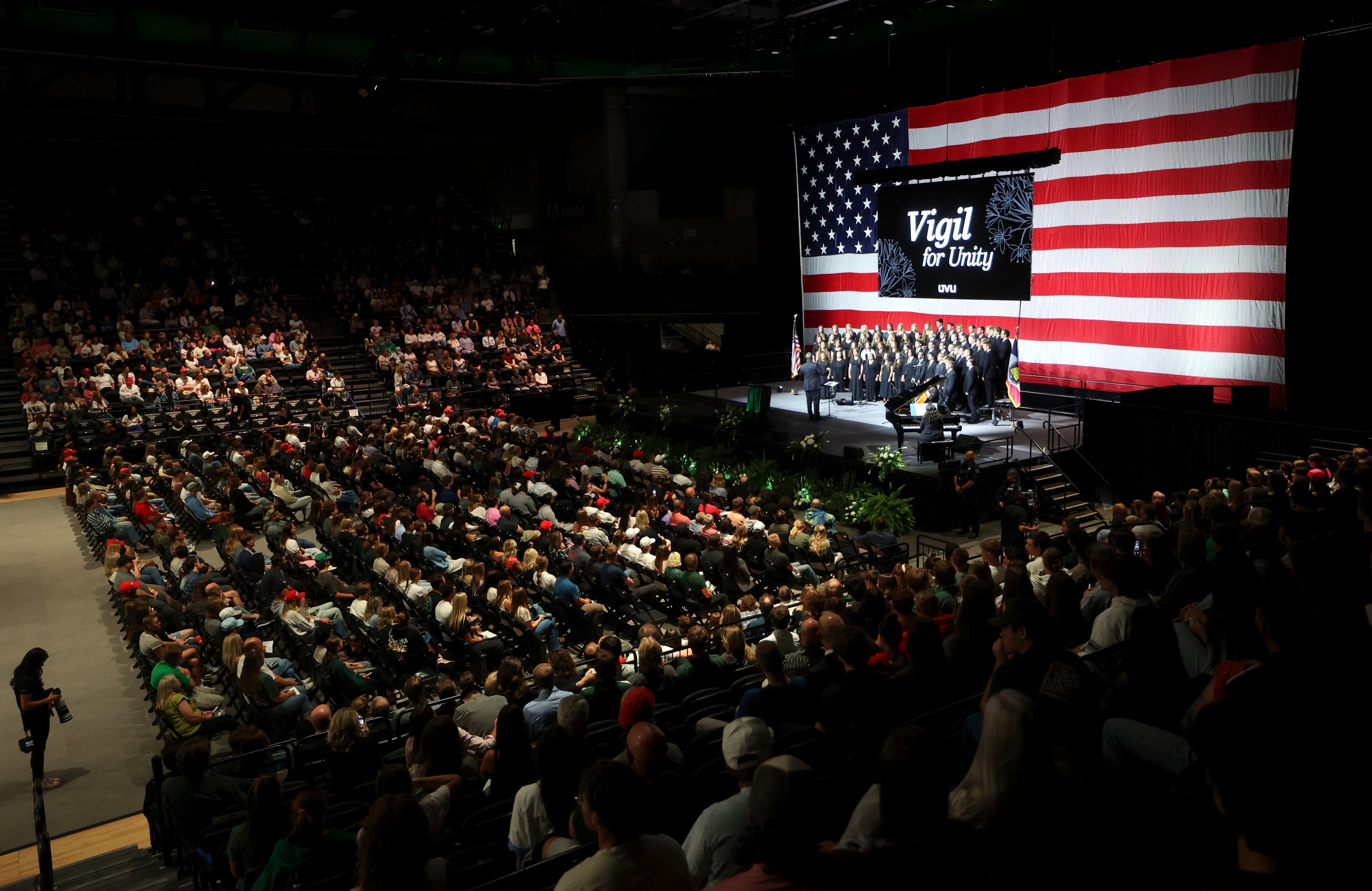Hundreds attend a Vigil for Unity at the UCCU Center at Utah Valley University in Orem on Friday, Sept. 19, 2025. Charlie Kirk, conservative activist and the founder and president of Turning Point USA, was fatally shot while answering questions at his American Comeback Tour at UVU on Sept. 10. (Kristin Murphy/The Deseret News via AP)