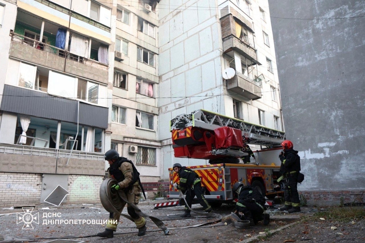 In this photo provided by the Ukrainian Emergency Services on Saturday, Sept. 20, 2025, rescuers work on a site of a residential house damaged by a Russian strike on Dnipro, Ukraine. (Ukrainian Emergency Service via AP)