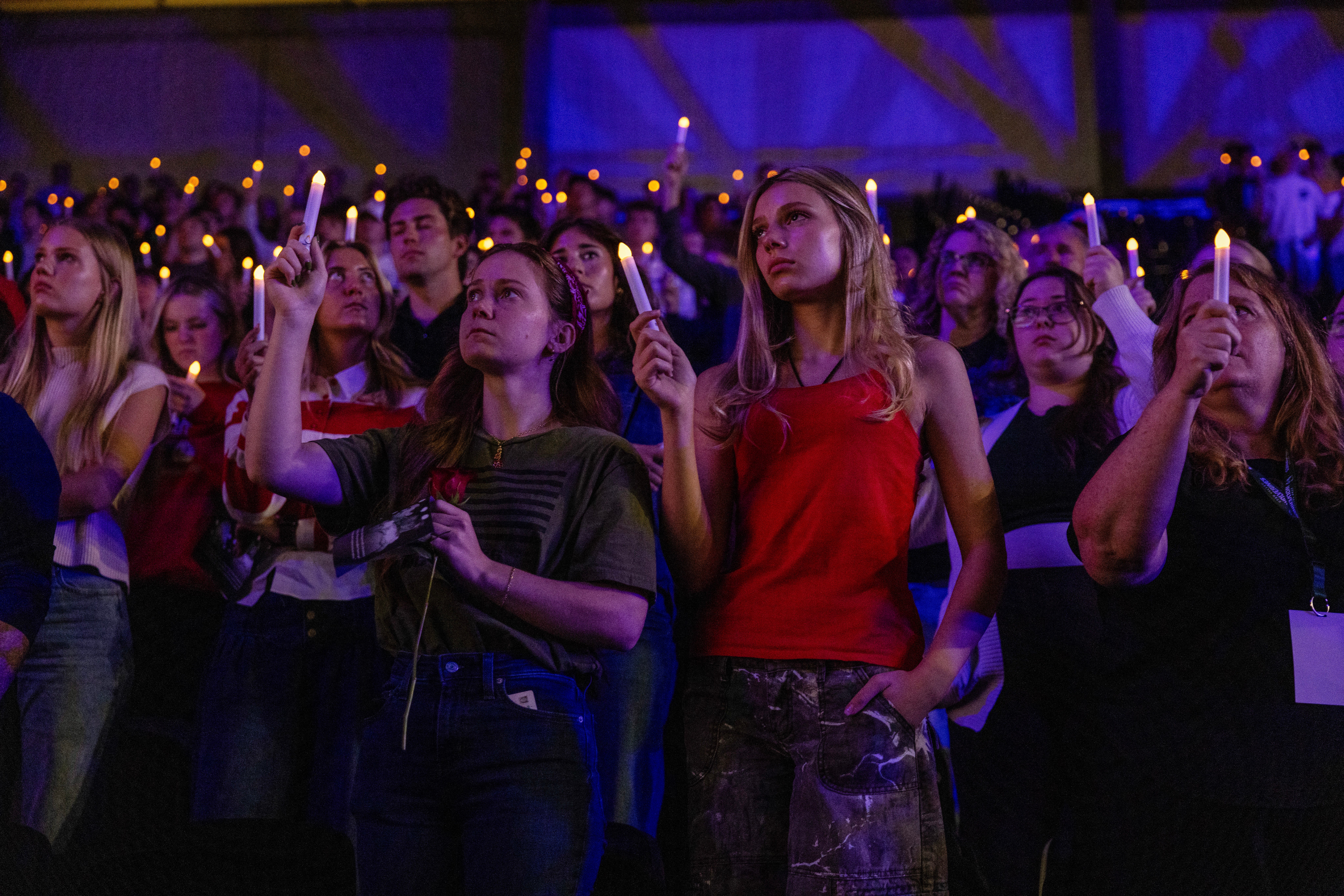 People pay their respects during a candlelight vigil for Charlie Kirk at Utah Valley University in Orem, Utah, on September 19, 2025