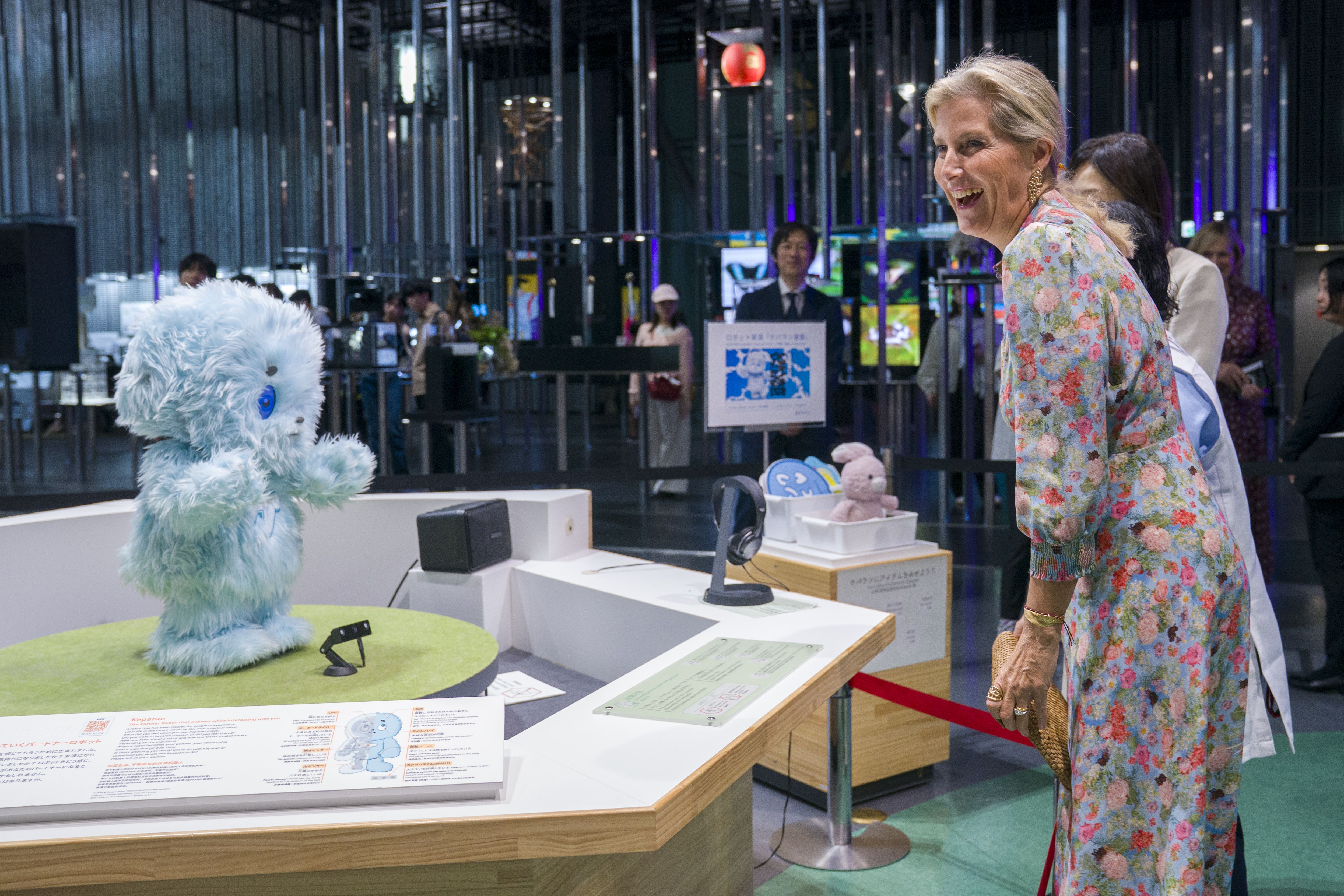 The Duchess of Edinburgh interacts with a robot during a visit to Miraikan, The National Museum of Emerging Science in Tokyo (Jane Barlow/PA)