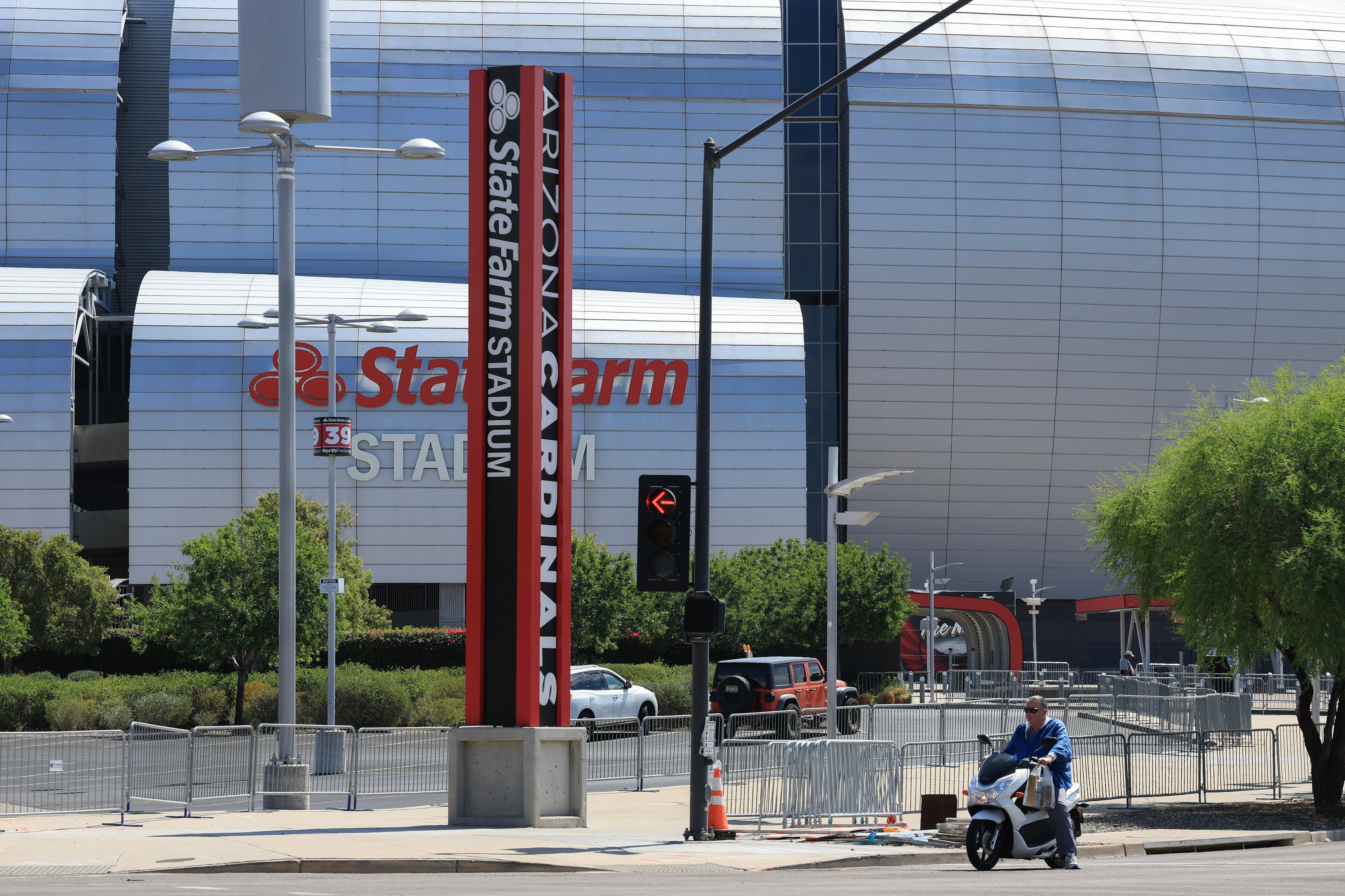 An armed man was detained at State Farm Stadium, home of the Arizona Cardinals, ahead of the upcoming memorial service for political activist Charlie Kirk