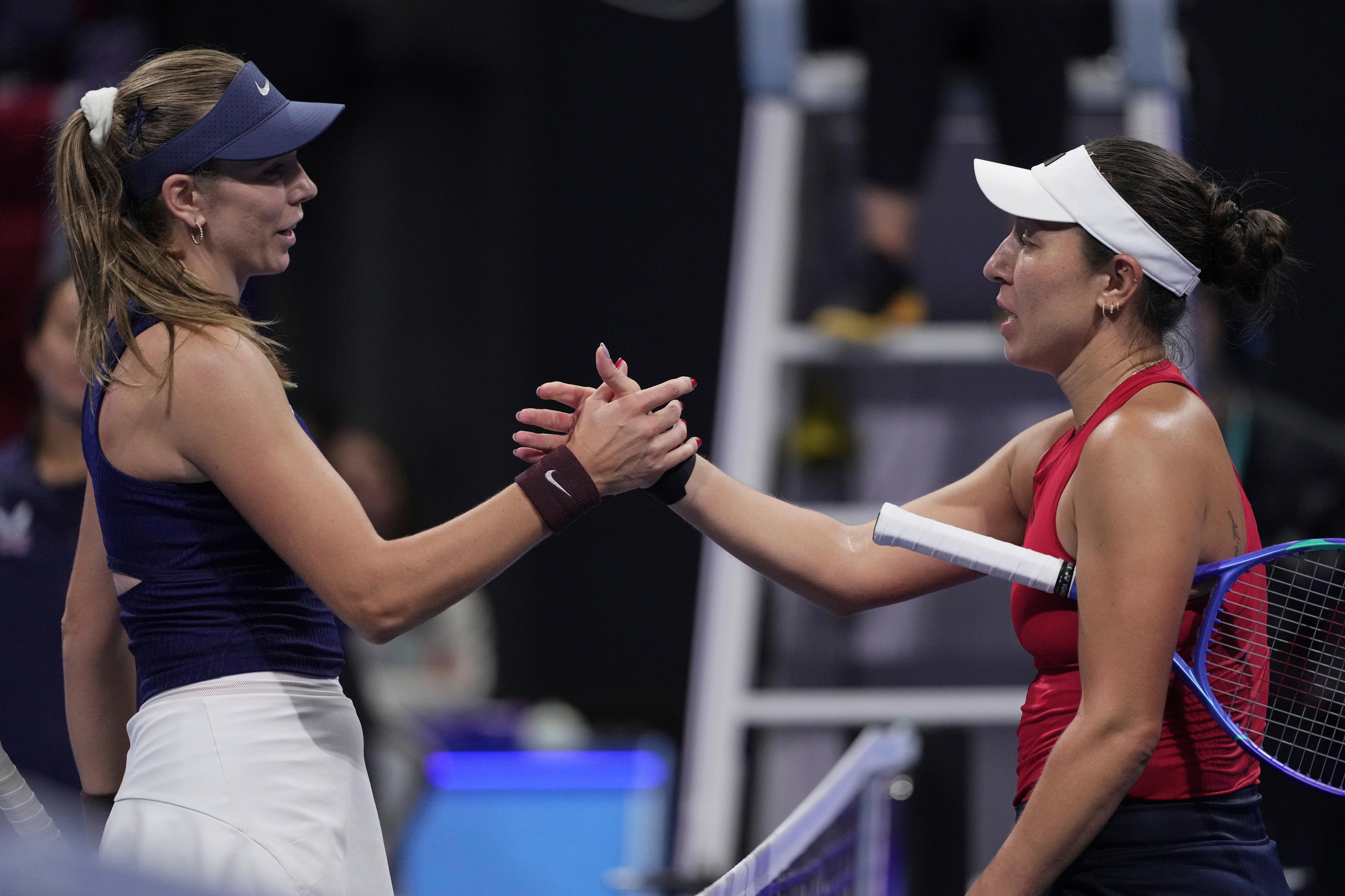 Jessica Pegula, of the United States shakes hands with Katie Boulter, of Britain after winning the Billie Jean King Cup semifinals tennis match, at the Shenzhen Bay Sports Center Arena, in Shenzhen, China’s Guangdong province, Saturday, Sept. 20, 2025. (AP Photo/Andy Wong)