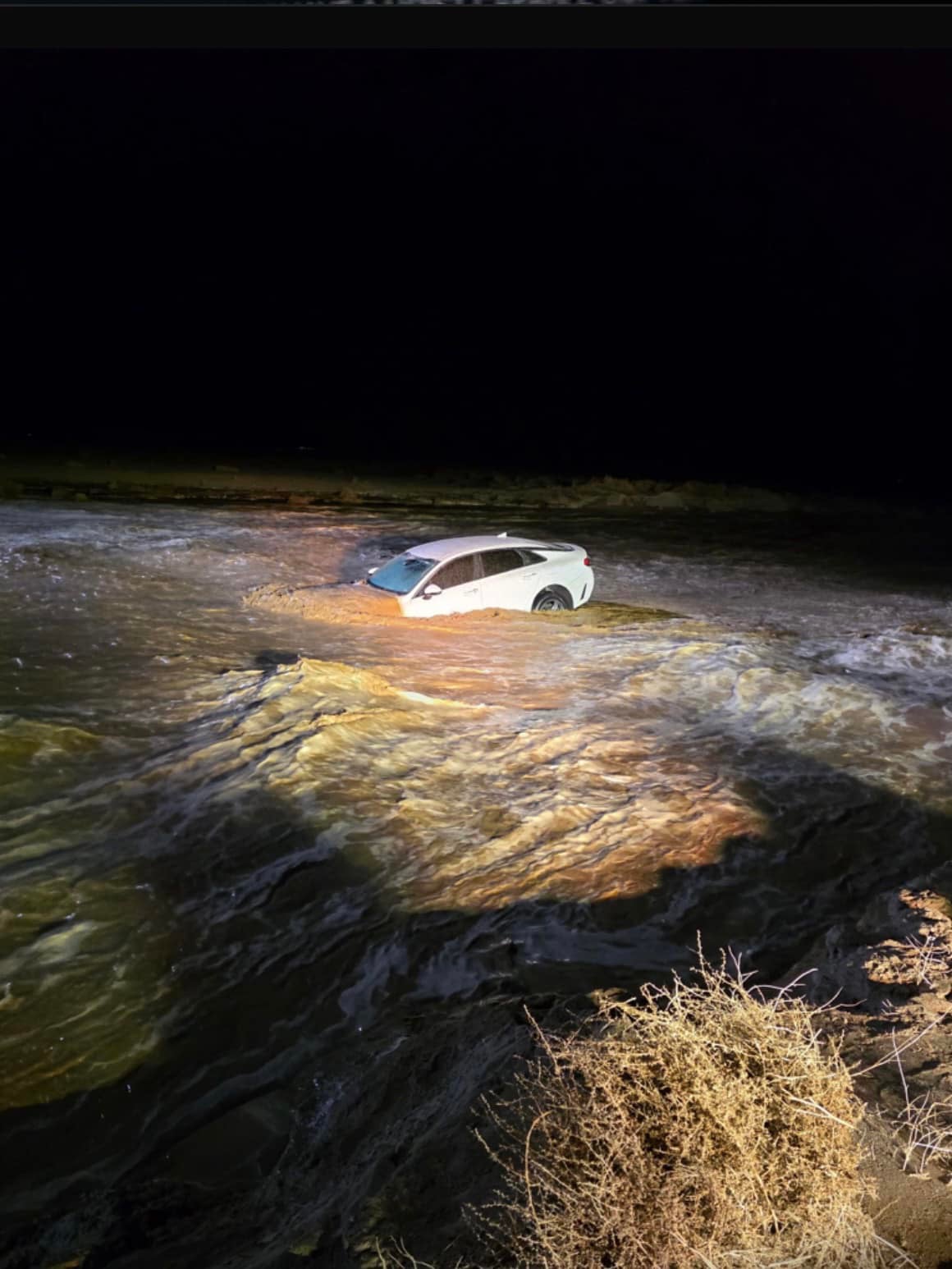 Police said Brandon Padilla Aguilera's vehicle was 'swept off the roadway by floodwaters' on Thursday night