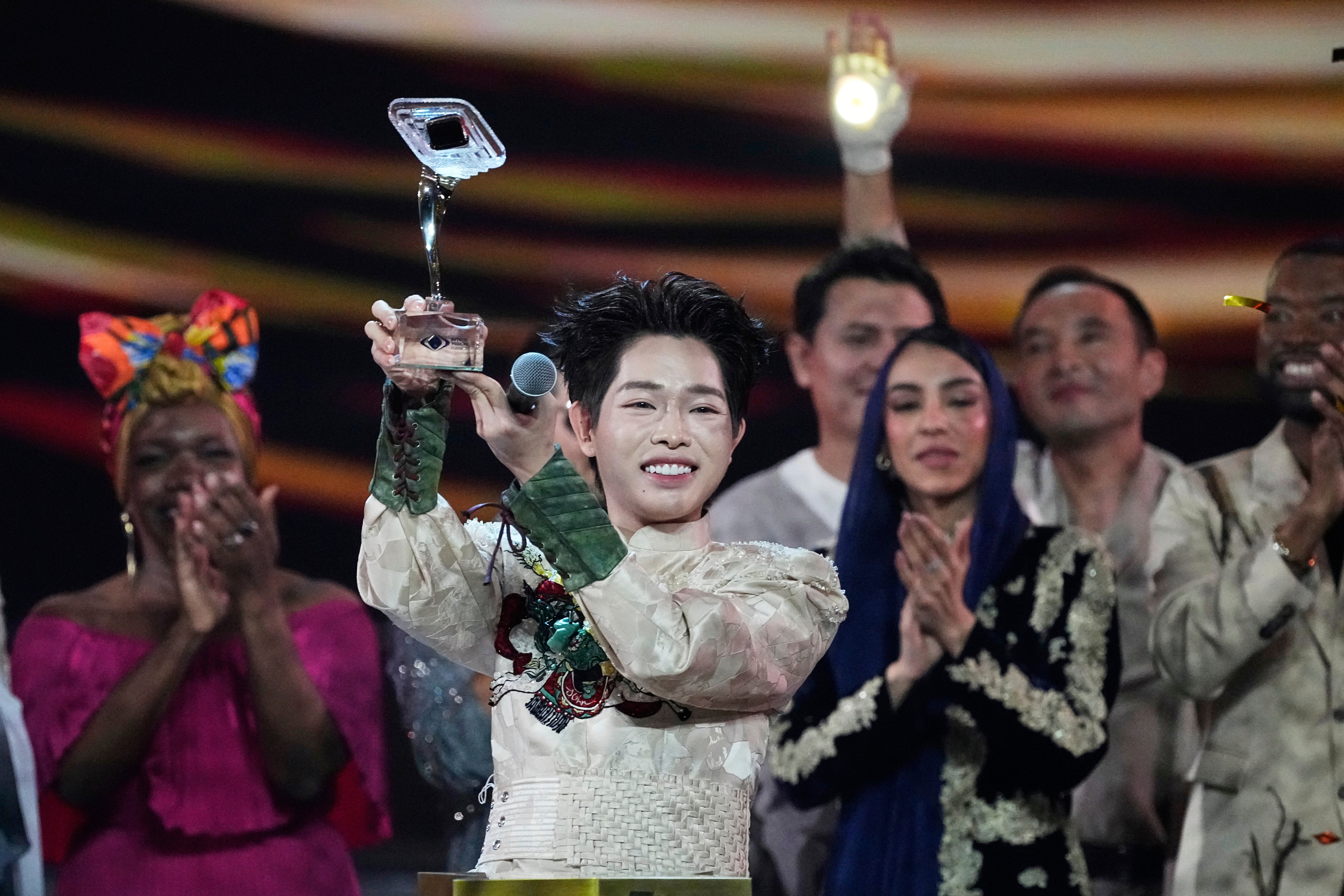 Vietnam's Duc Phuc holds his trophy after winning the International Music Competition "Intervision" at the Live Arena outside Moscow, Russia, Sunday, Sept. 21, 2025. (AP Photo/Alexander Zemlianichenko)