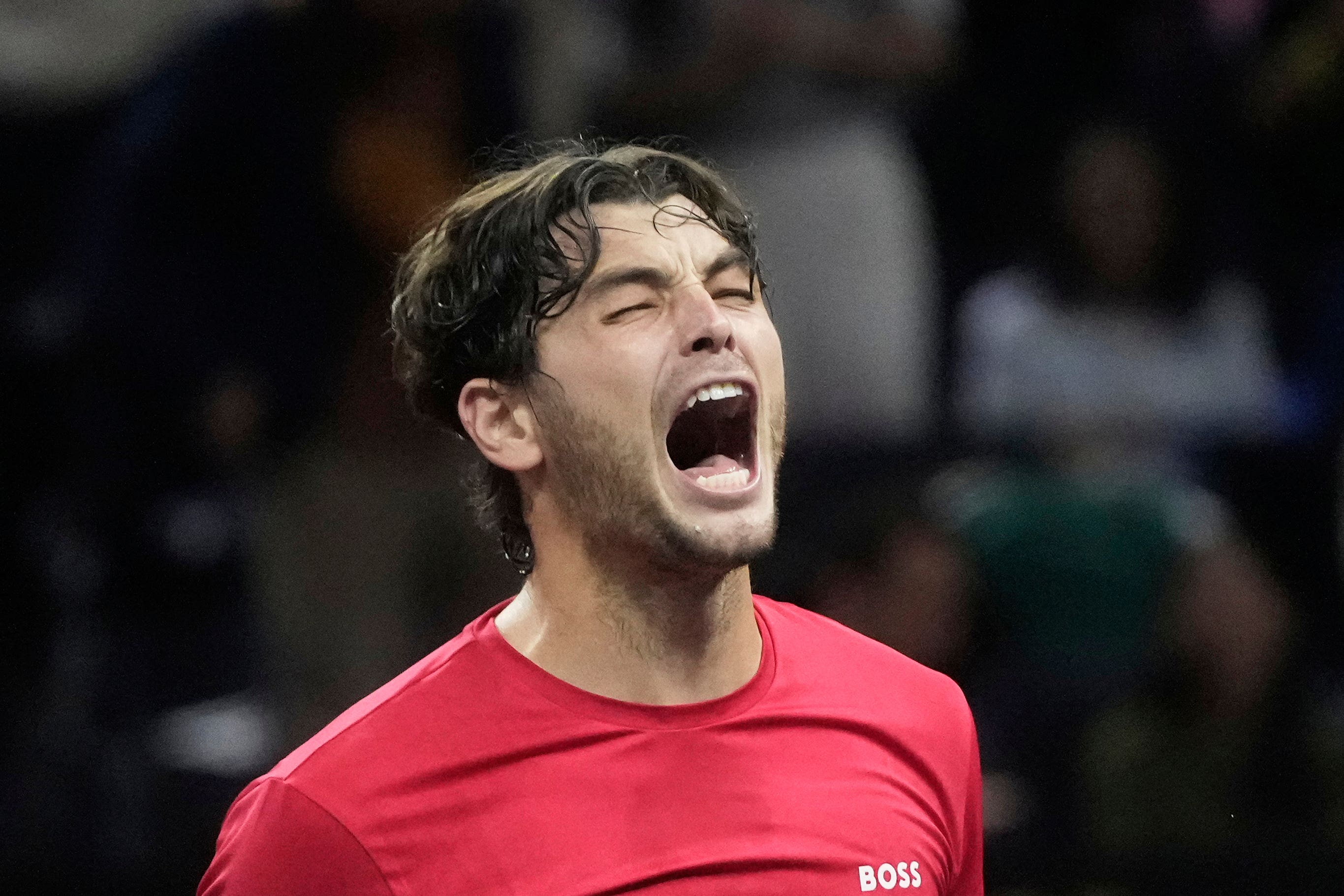 Team World’s Taylor Fritz, of the United States, celebrates after defeating Team Europe’s Carlos Alcaraz (Jeff Chiu/AP)
