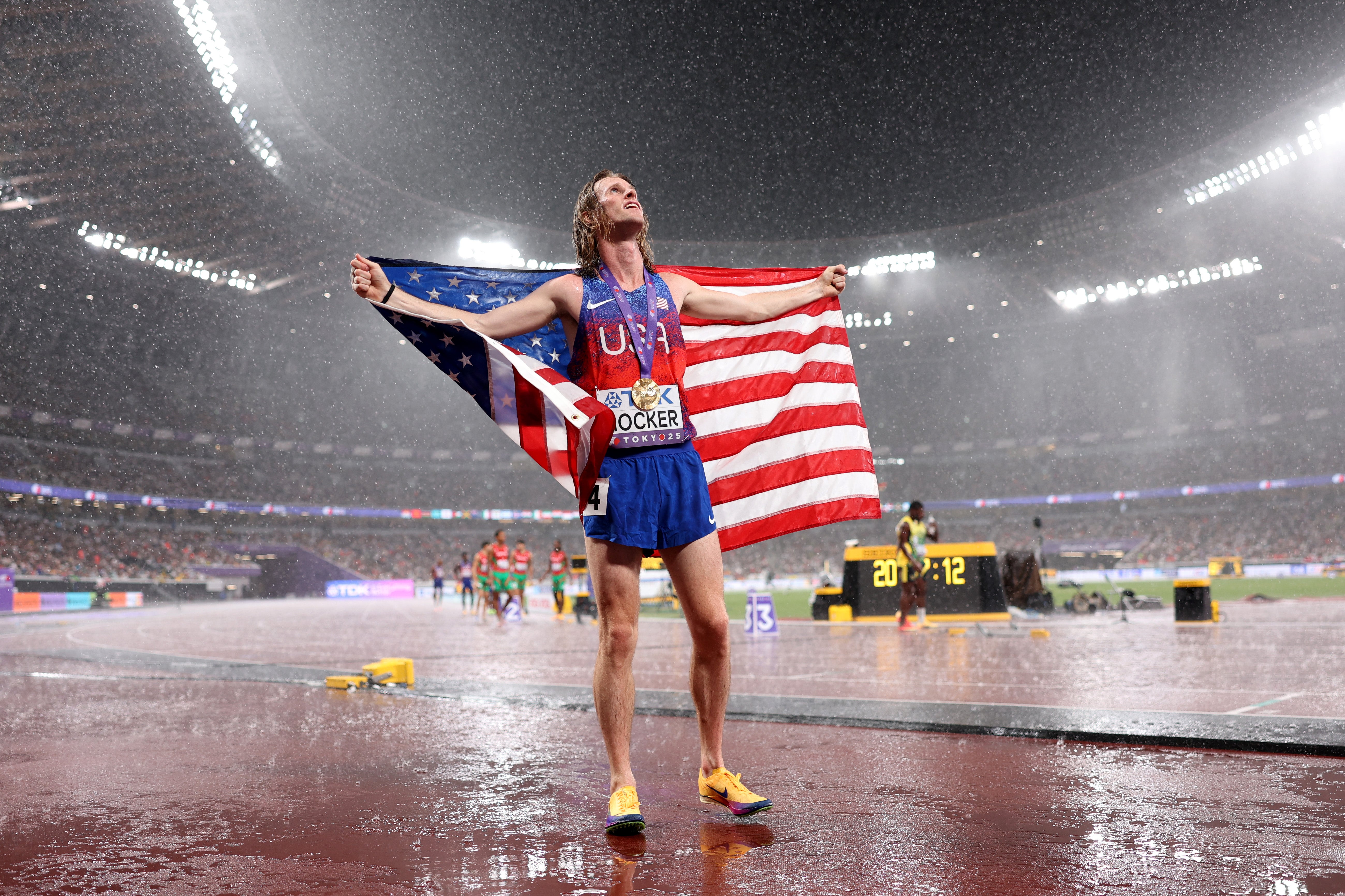 Cole Hocker celebrates in the Tokyo rain