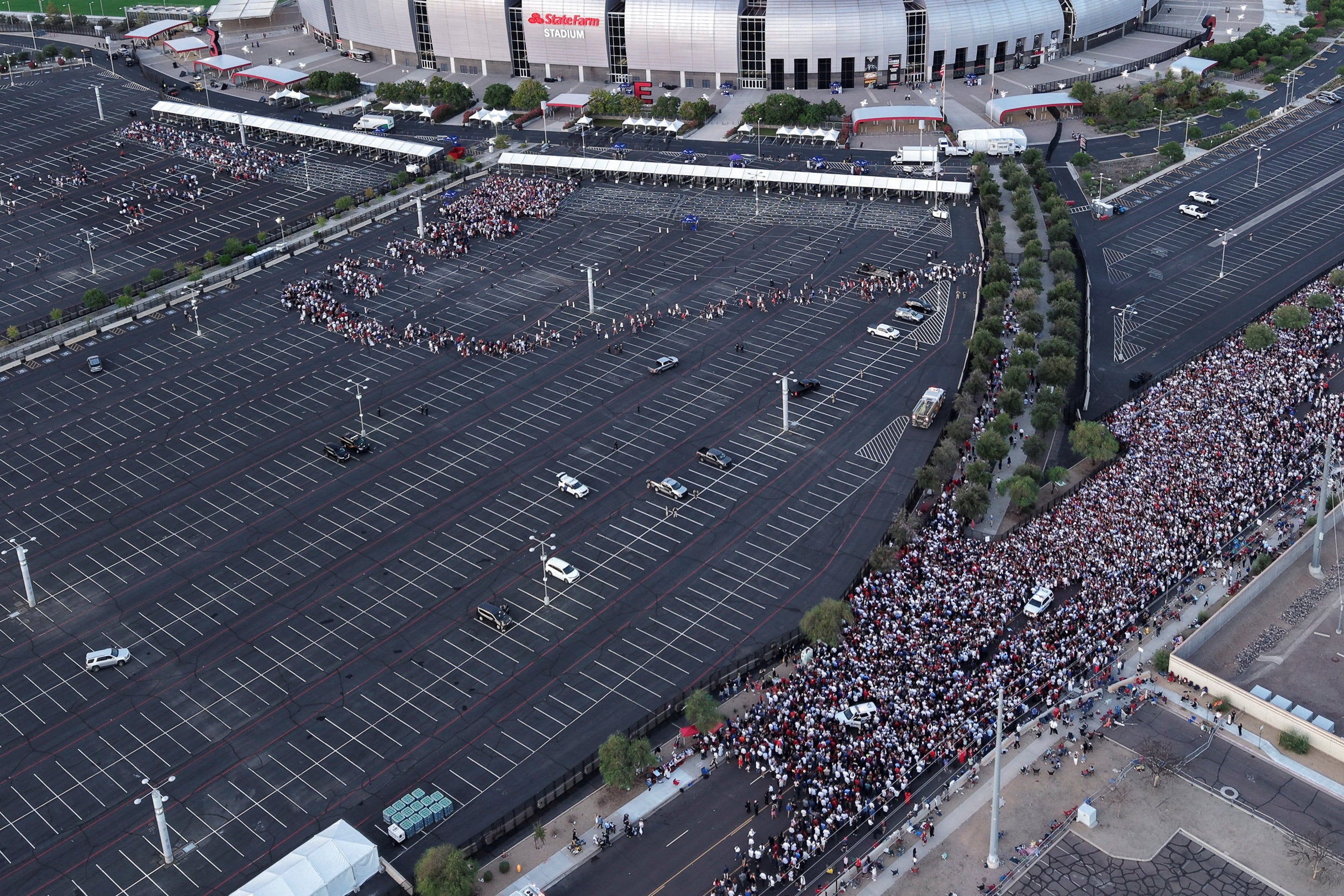 Pictures of the event showed snaking lines stretching back from the stadium, and memorial planners were forced to send attendees to Desert Diamond Arena one block north, which has a capacity of 20,000