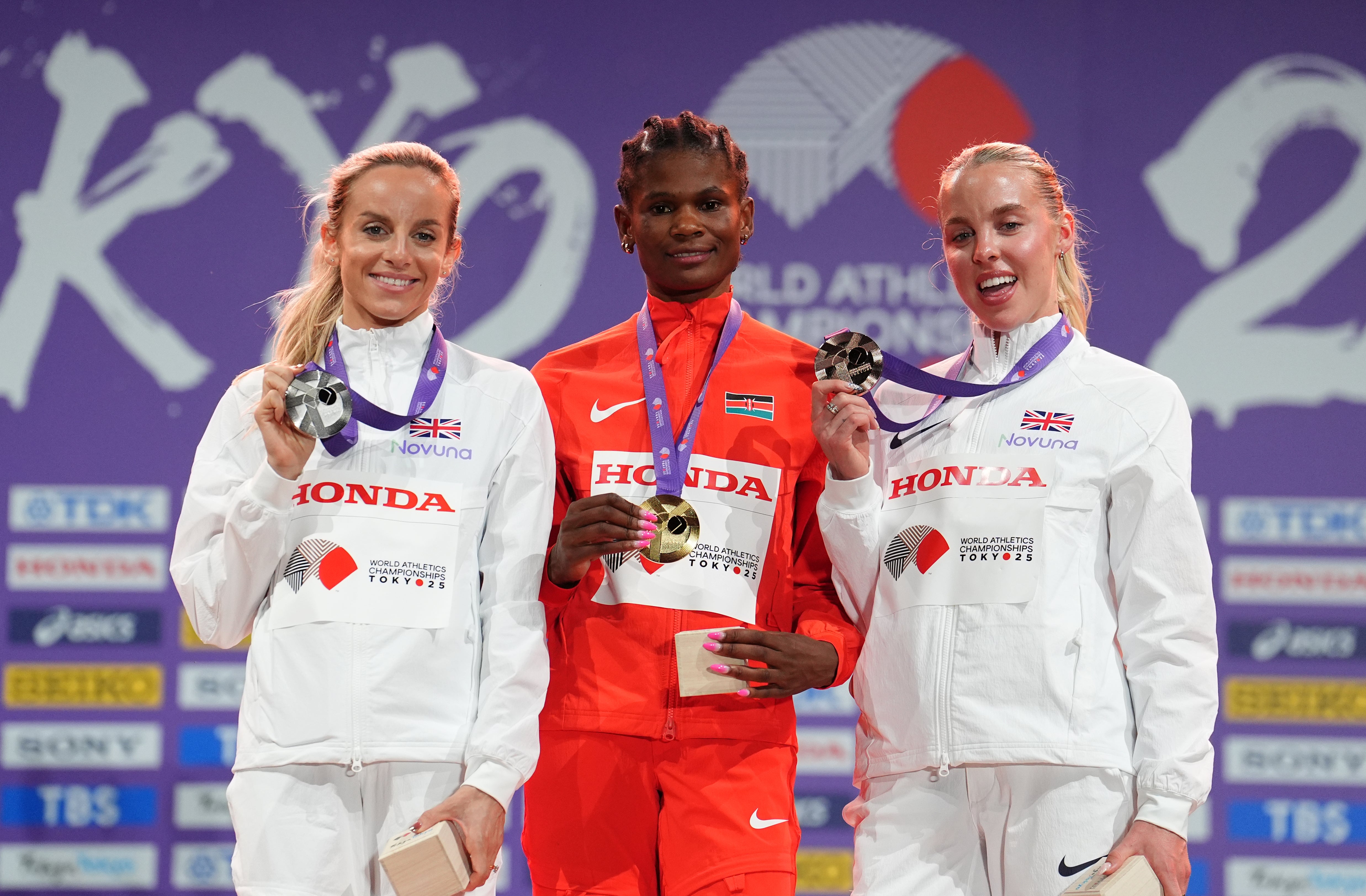 Hunter Bell, Odira and Hodgkinson on the podium (Martin Rickett/PA)