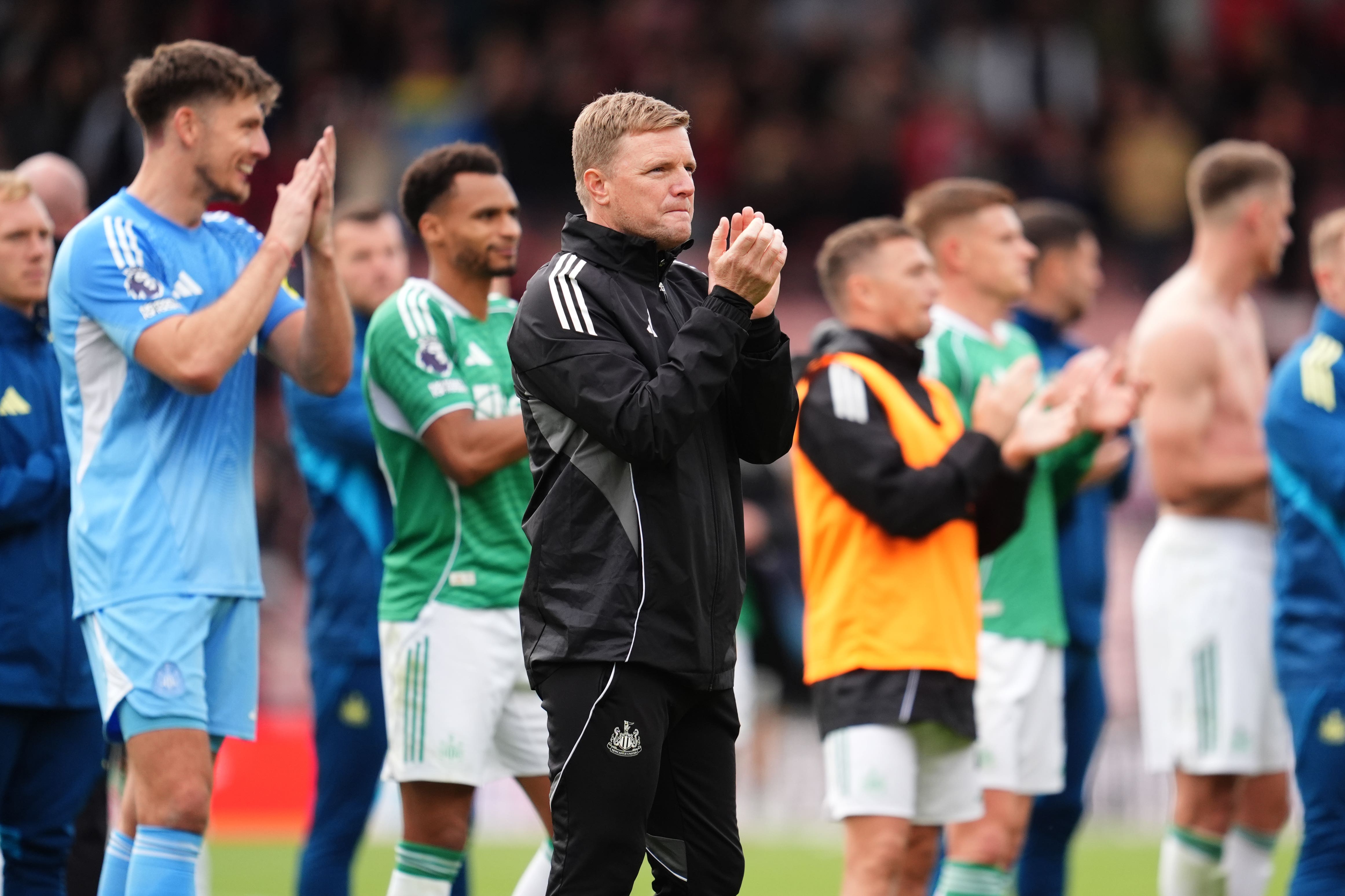 Eddie Howe and the Newcastle players applaud the travelling fans at full-time (Adam Davy/PA)