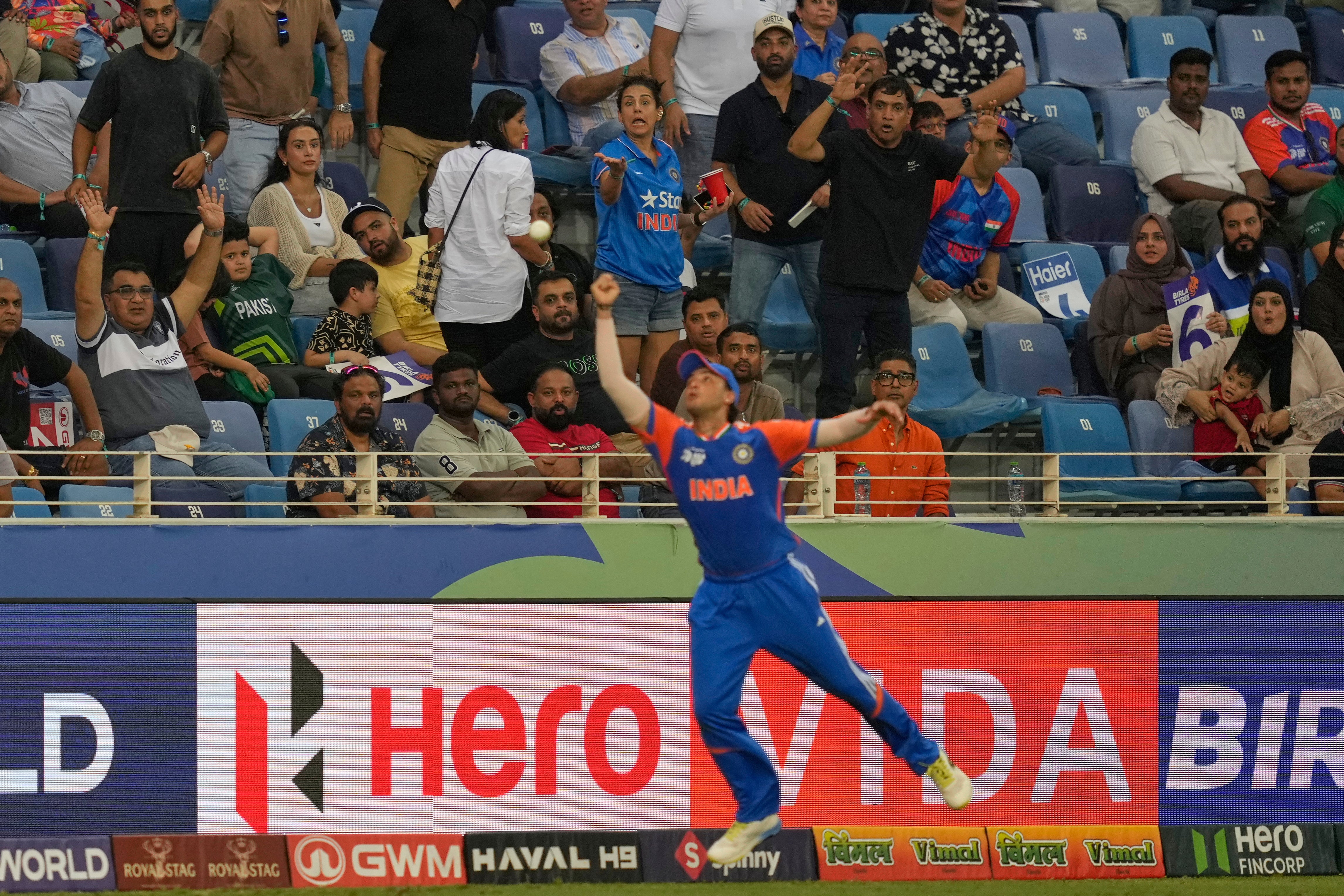 Spectators react as India's Abhishek Sharma drops the catch of Pakistan's Sahibzada Farhan during the Asia Cup cricket match between India and Pakistan at Dubai International Cricket Stadium in Dubai, United Arab Emirates, Sunday, 21 September 2025