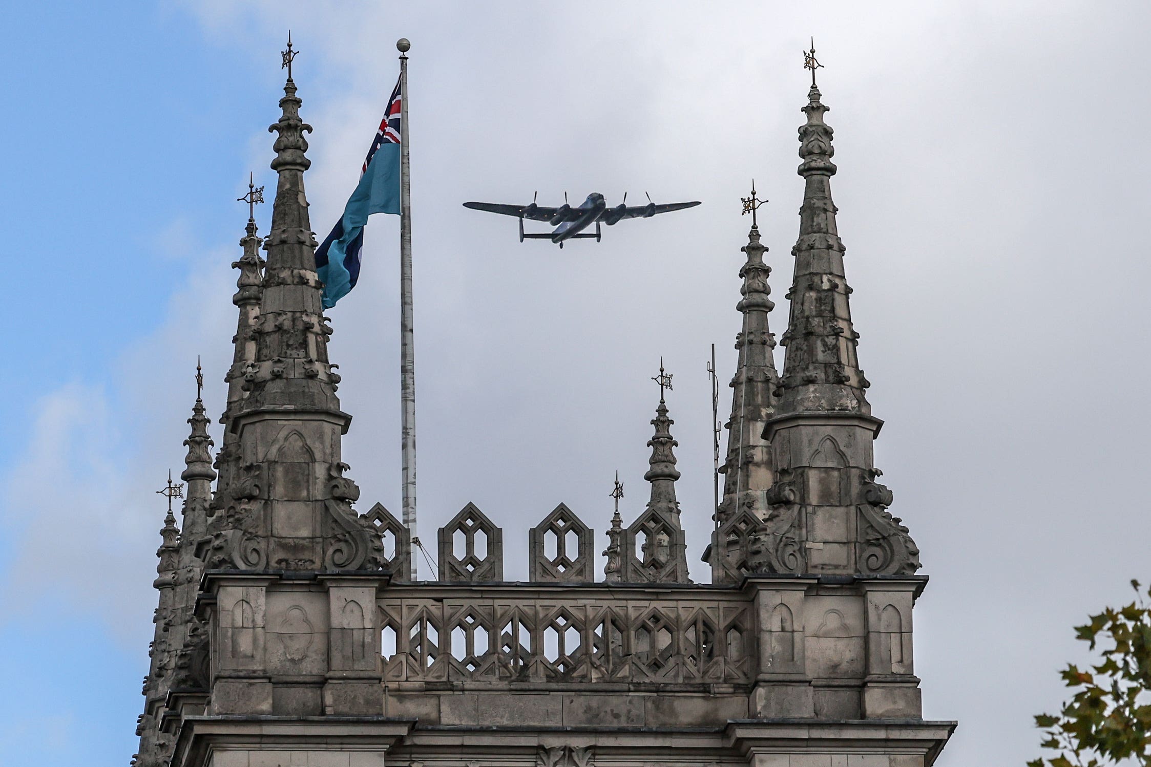 The Avro Lancaster heavy bomber of the Battle of Britain Memorial Flight performs a flypast (Richard Pohle/The Times/PA)