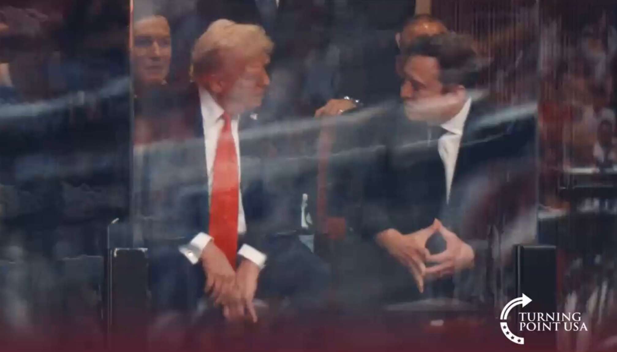 Donald Trump and Elon Musk pictured speaking at a memorial for Charlie Kirk in Glendale, Arizona