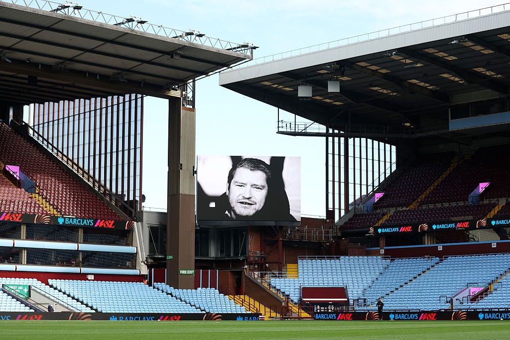 A picture in remembrance of Matt Beard is shown on the screen at Villa Park