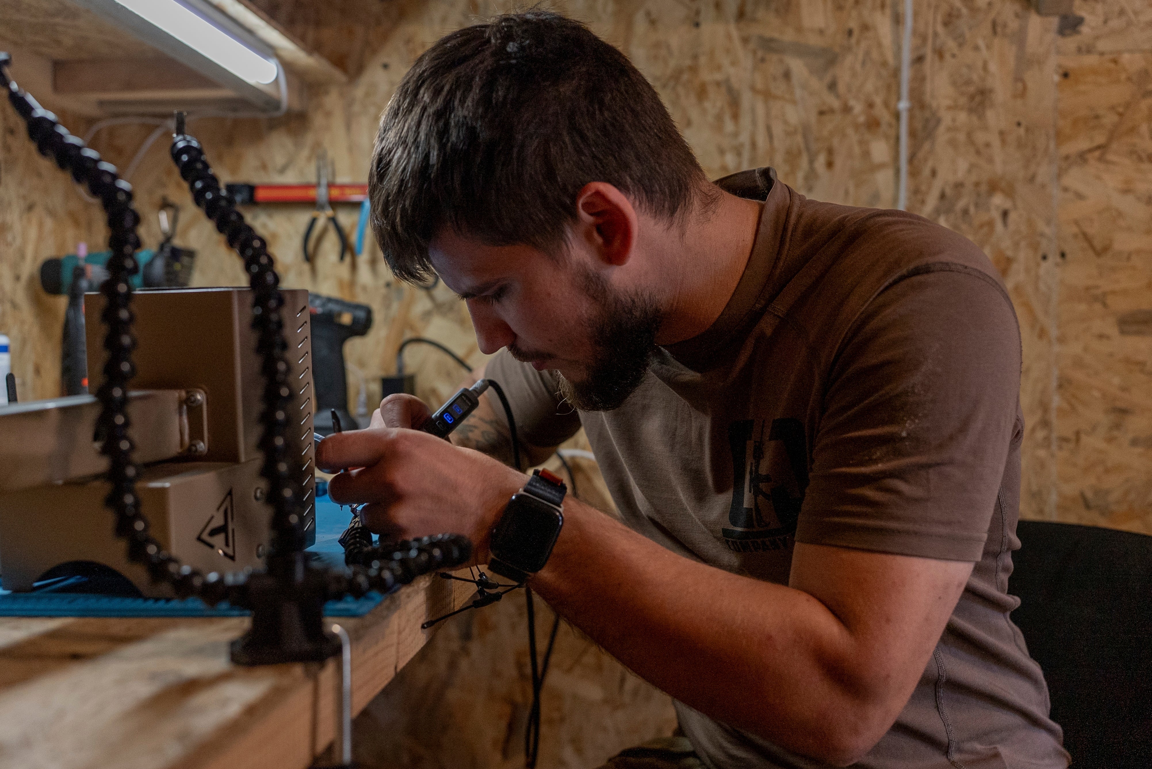 A Ukrainian serviceman known by the call sign ‘Miami’ works on robotic military equipment near the front line in Donetsk region, Ukraine, on Monday, Sept. 8, 2025. (AP Photo/Alex Babenko)