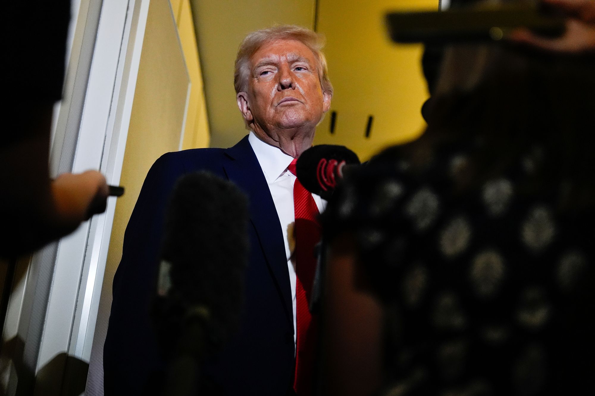 President Donald Trump speaks to reporters aboard Air Force One after attending a memorial for conservative activist Charlie Kirk in Glendale, Arizona, on Sunday September 21 2025