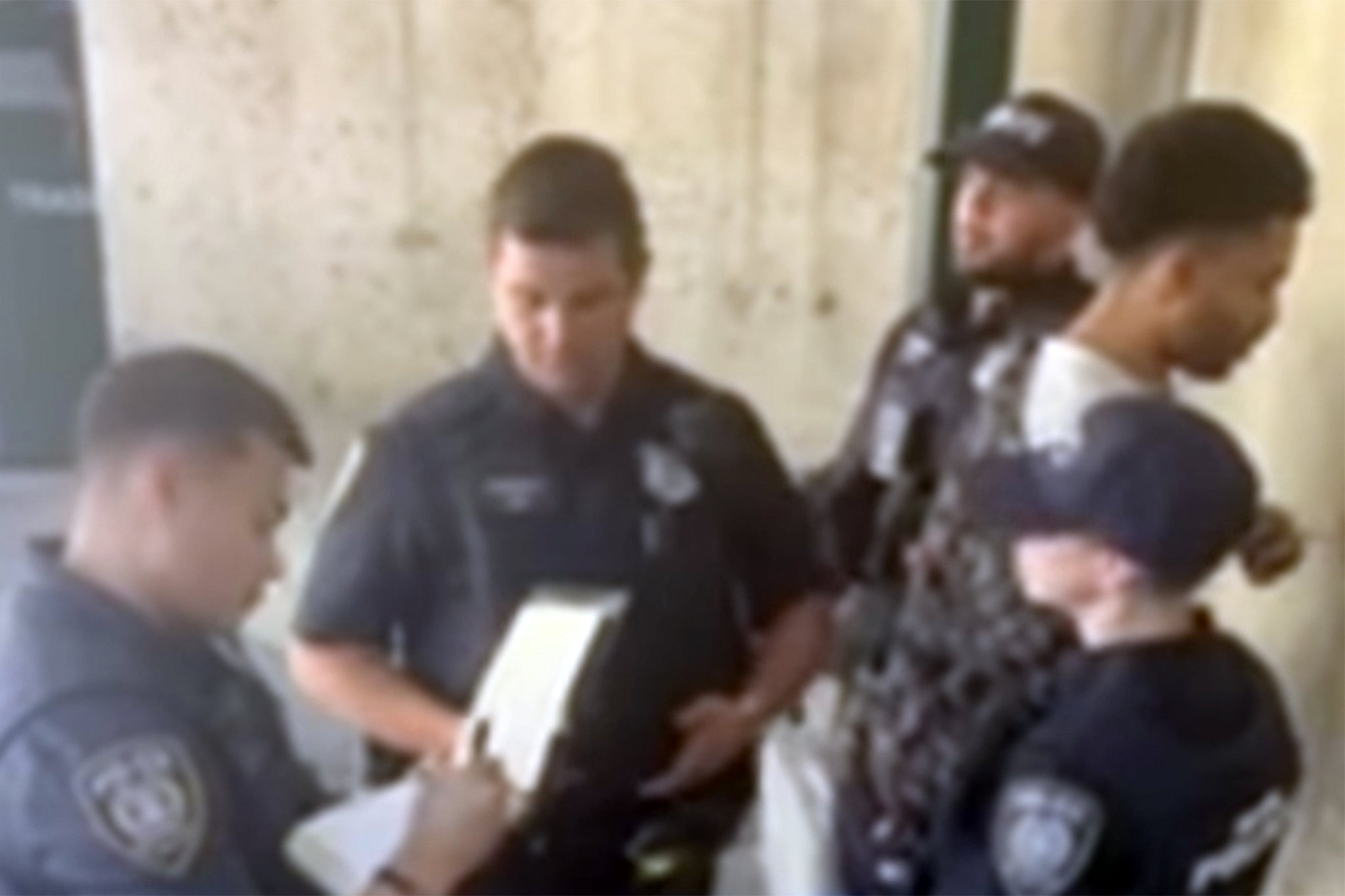 Alex O’Keefe, shown right, was arrested after a white lady allegedly complained about how he was sitting