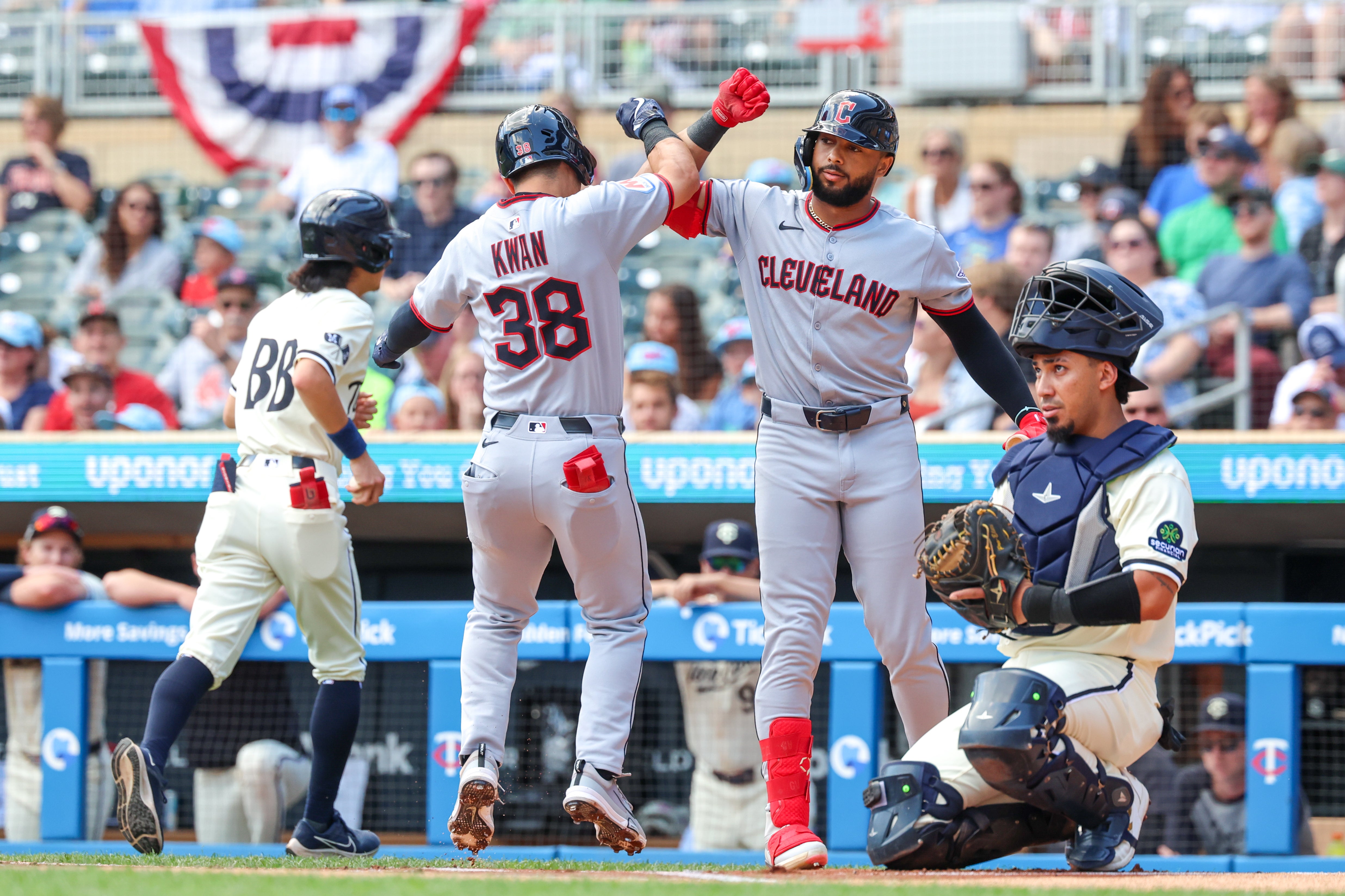 Steven Kwan #38 of the Cleveland Guardians celebrates a solo home run
