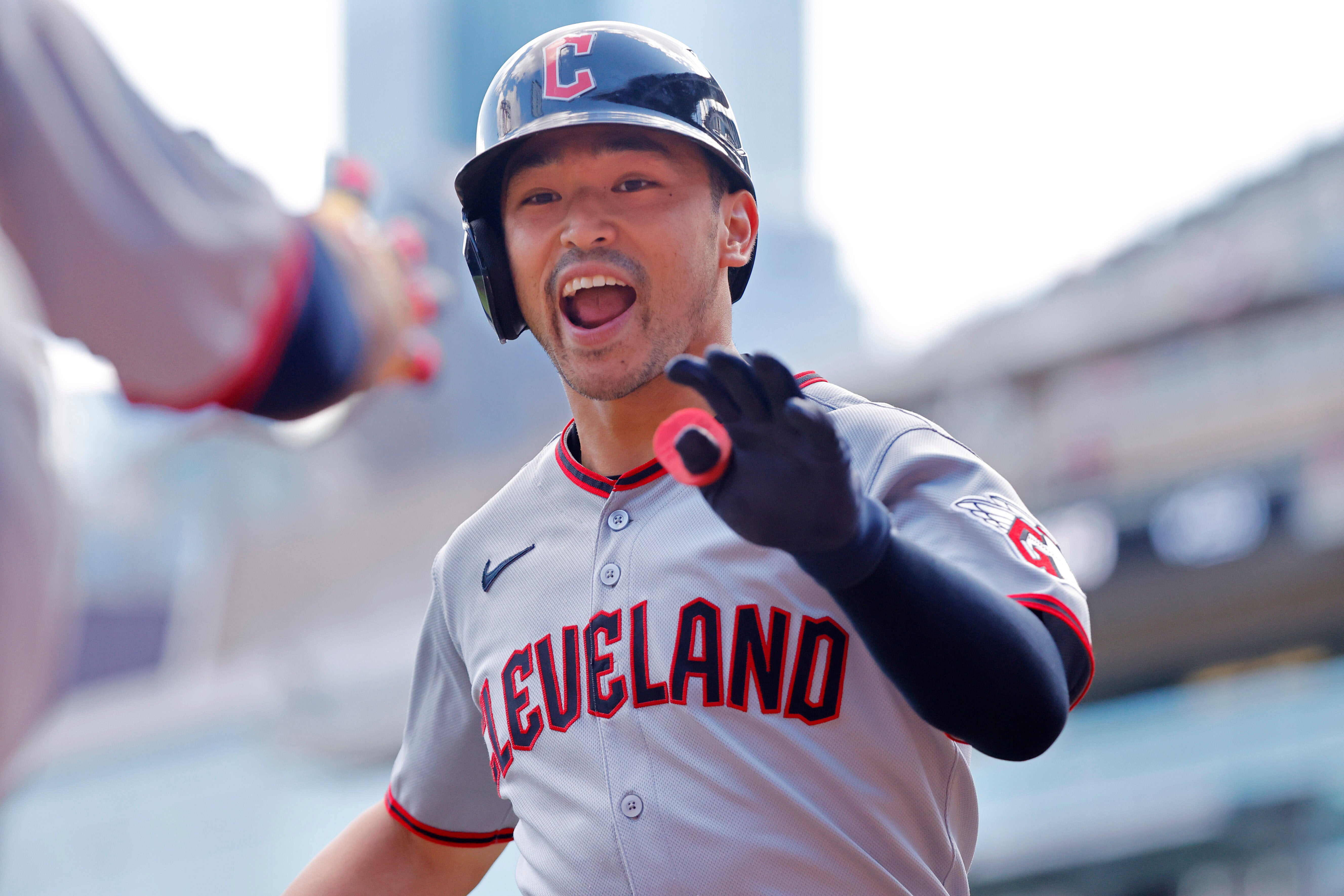 <p>Cleveland Guardians' Steven Kwan celebrates after his leadoff home run against the Minnesota Twins </p>