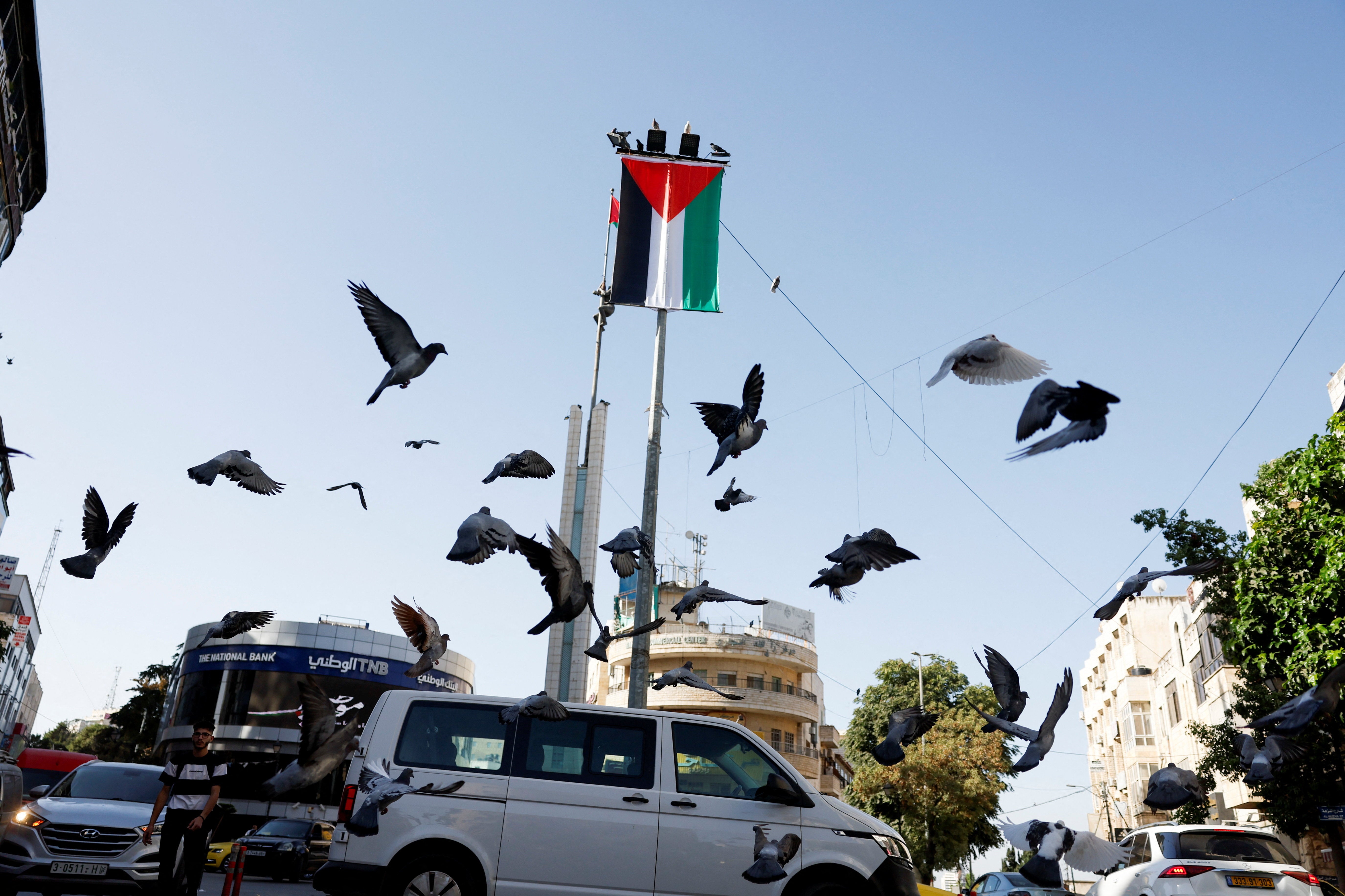 A Palestinian flag hangs on a pole in the centre of Ramallah in the Israeli-occupied West Bank
