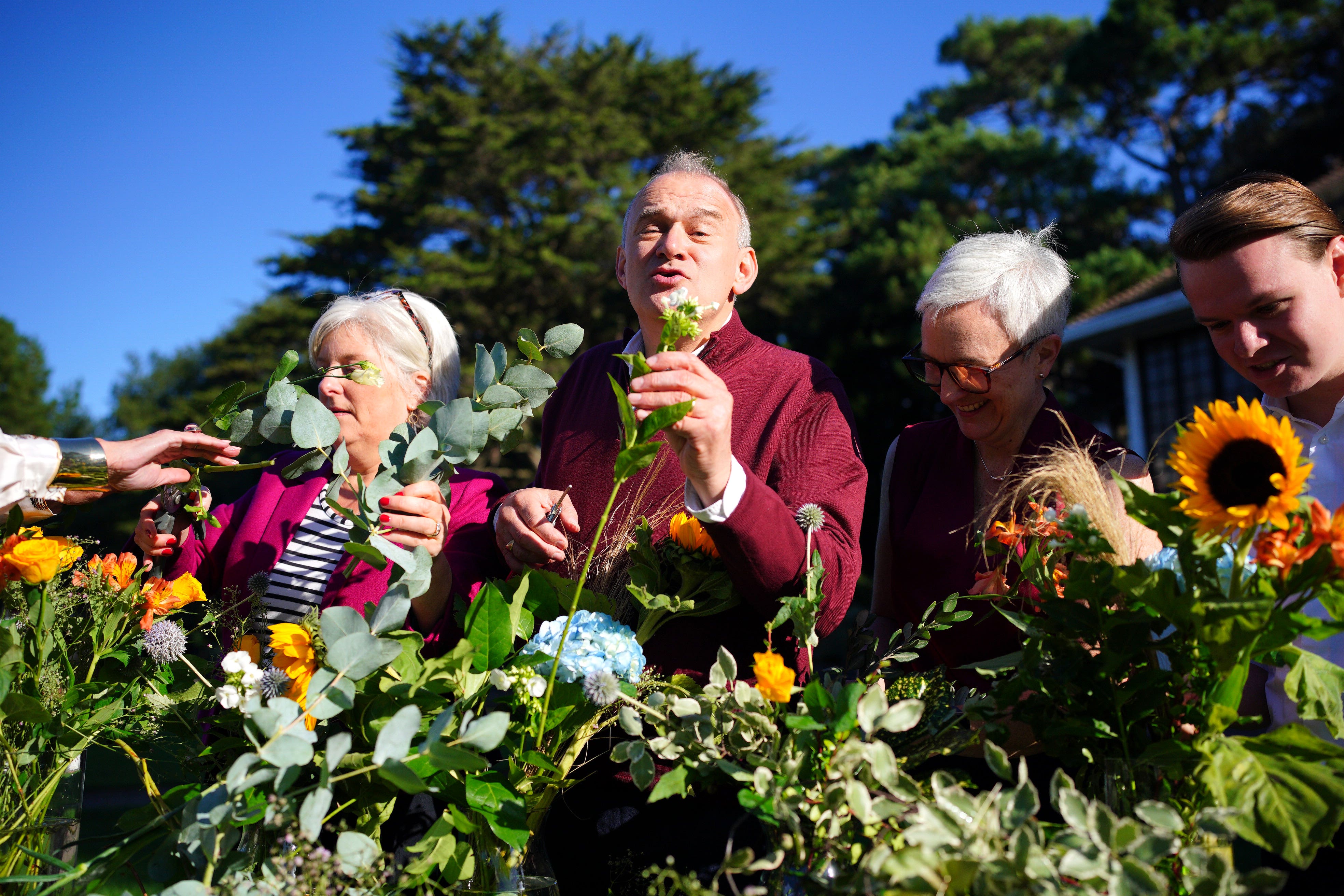 Liberal Democrats leader Sir Ed Davey takes part in a flower-arranging workshop during his visit to Bournemouth Lower Gardens (Ben Birchall/PA)