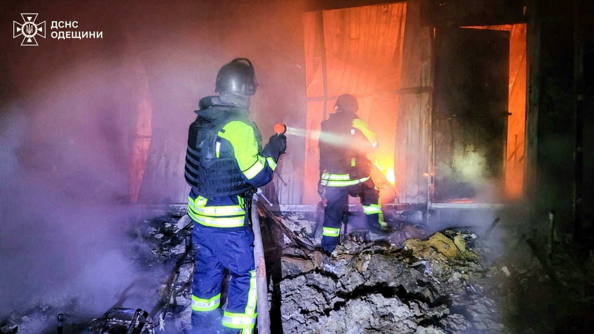 In this photo provided by the Ukrainian Emergency Service, firefighters put out the fire following a Russian missile attack in Tatarbunary, Odesa region