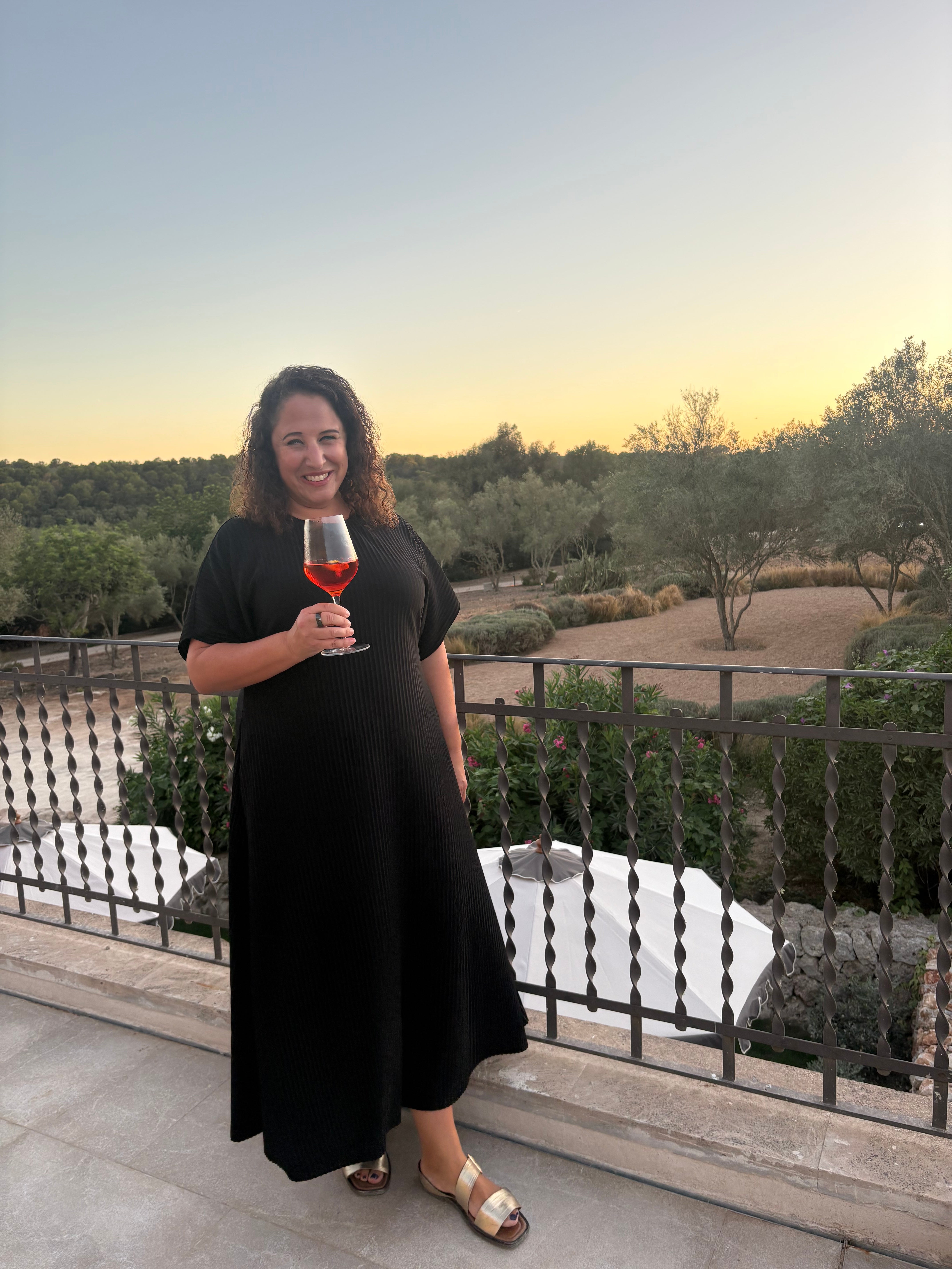 Writer Isabelle Kliger enjoys sunset and a glass of wine at Son Xotano, Mallorca