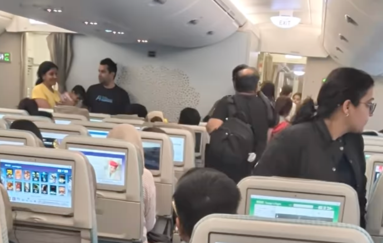 Video shows Emirates passengers preparing to disembark a plane from San Francisco to Dubai after President Donald Trump's H-1B visa application fee announcement sparked confusion