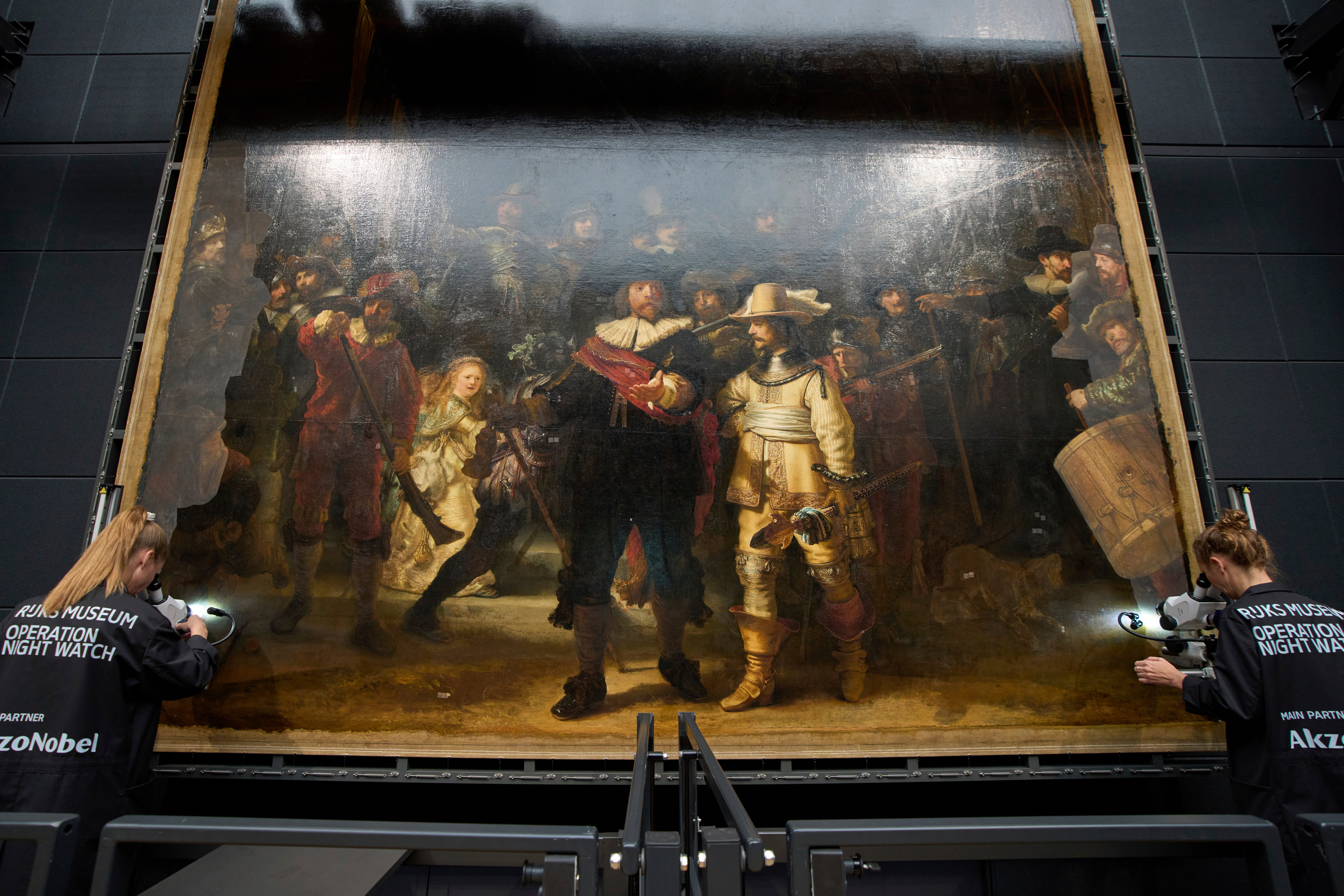 Art restorers work on Rembrandt's Night Watch at Amsterdam's Rijksmuseum