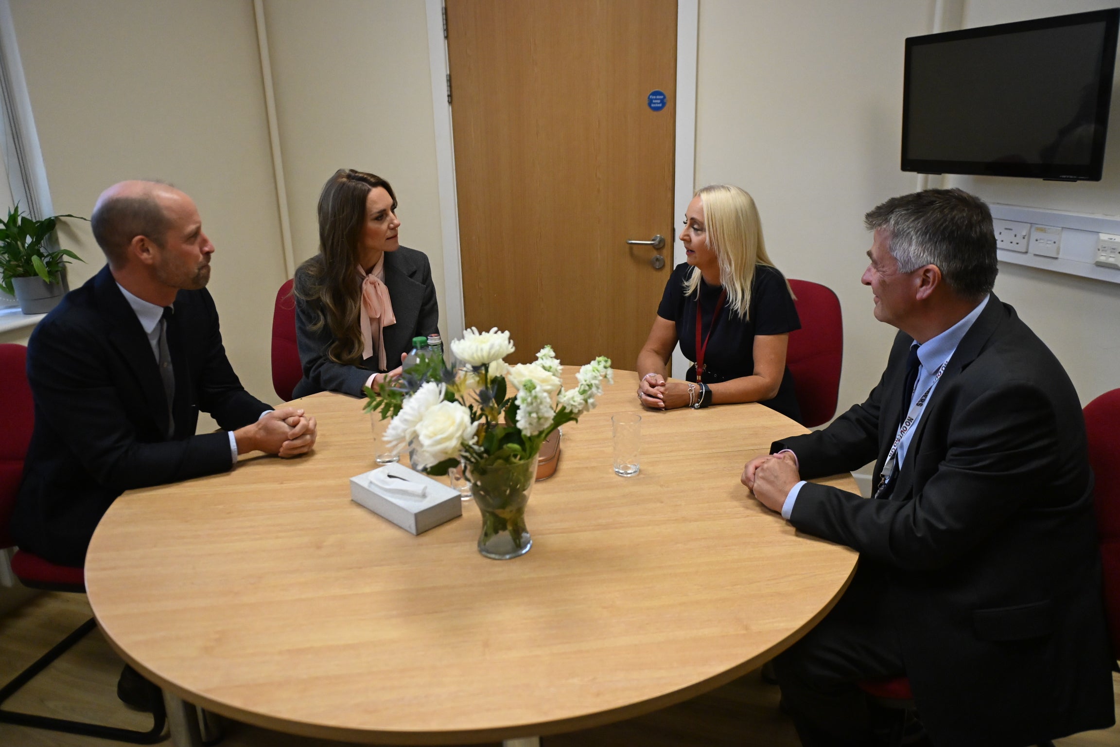 The Prince and Princess of Wales speak with Farnborough Road School headteachers Adrian Antell, right, Jennie Sephton, second right