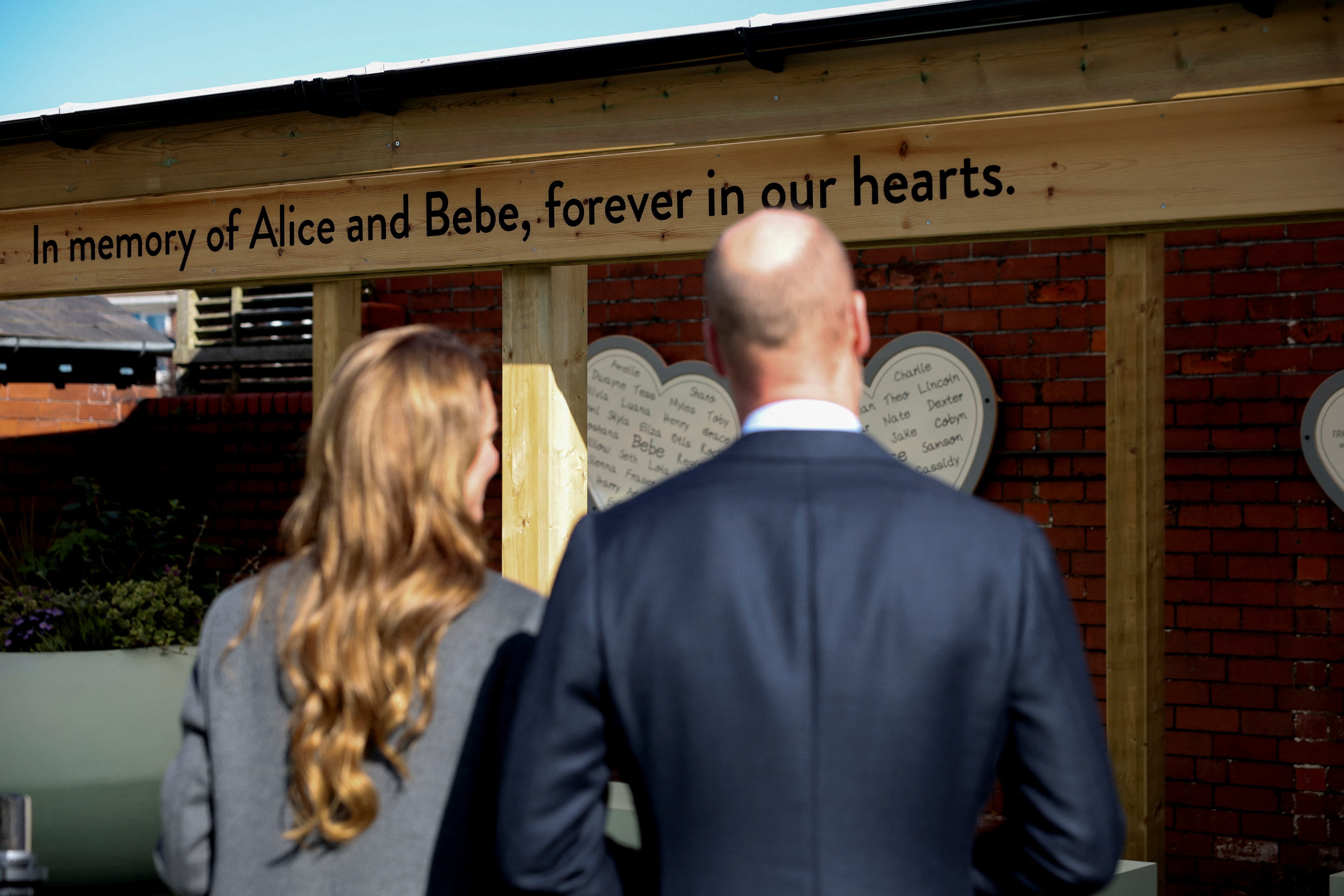 The Prince and Princess of Wales view the new commemorative playground during a visit to Churchtown Primary School in Southport
