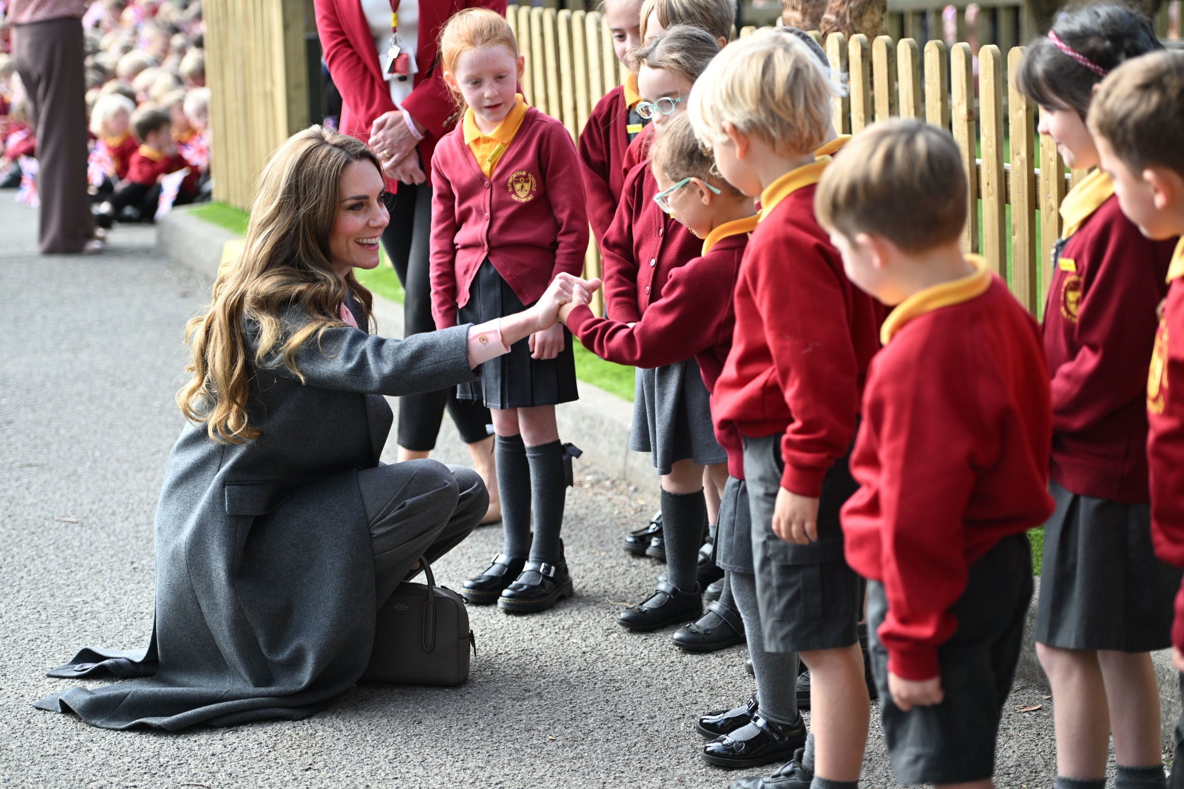 The Princess of Wales speaks to some of the younger pupils
