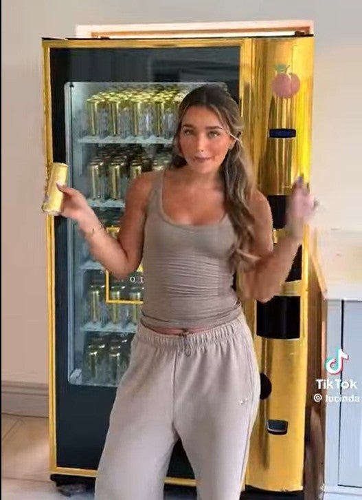 A TikTok post by social media influencer Lucinda Strafford in June showed her filling a large gold-coloured vending machine which featured the Au Vodka logo