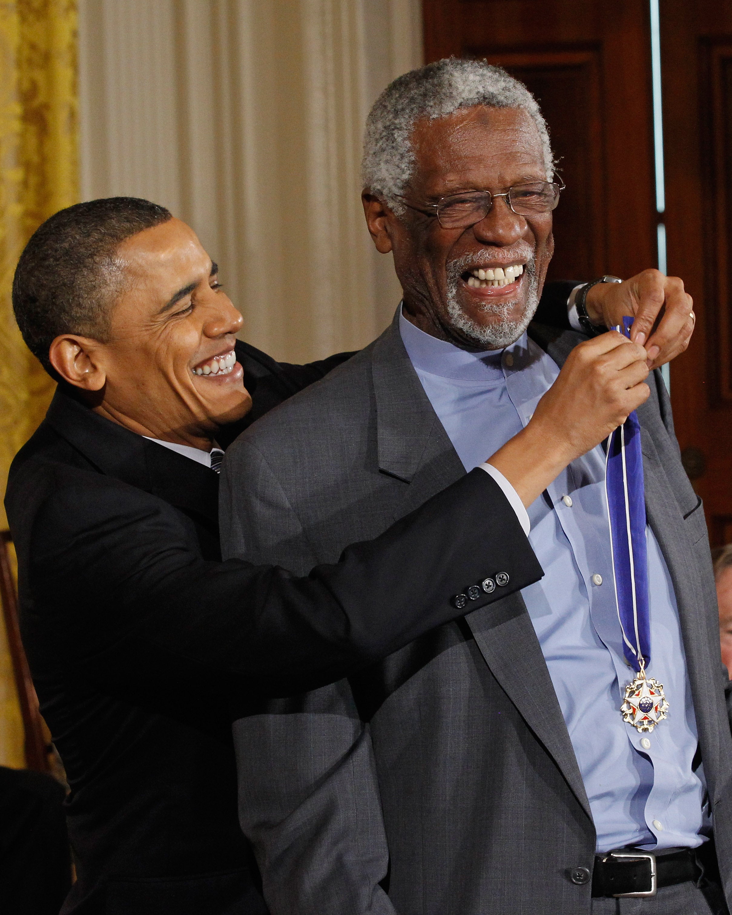 As a volunteer at the Basketball Hall of Fame, Tracy Shirer was tasked with, among other things, looking after NBA legend Bill Russell, seen here in 2010 receiving the Presidential Medal of Freedom from President Obama. But Shirer claims she was later rejected for a paying job because hall president and CEO John Doleva does not hire women