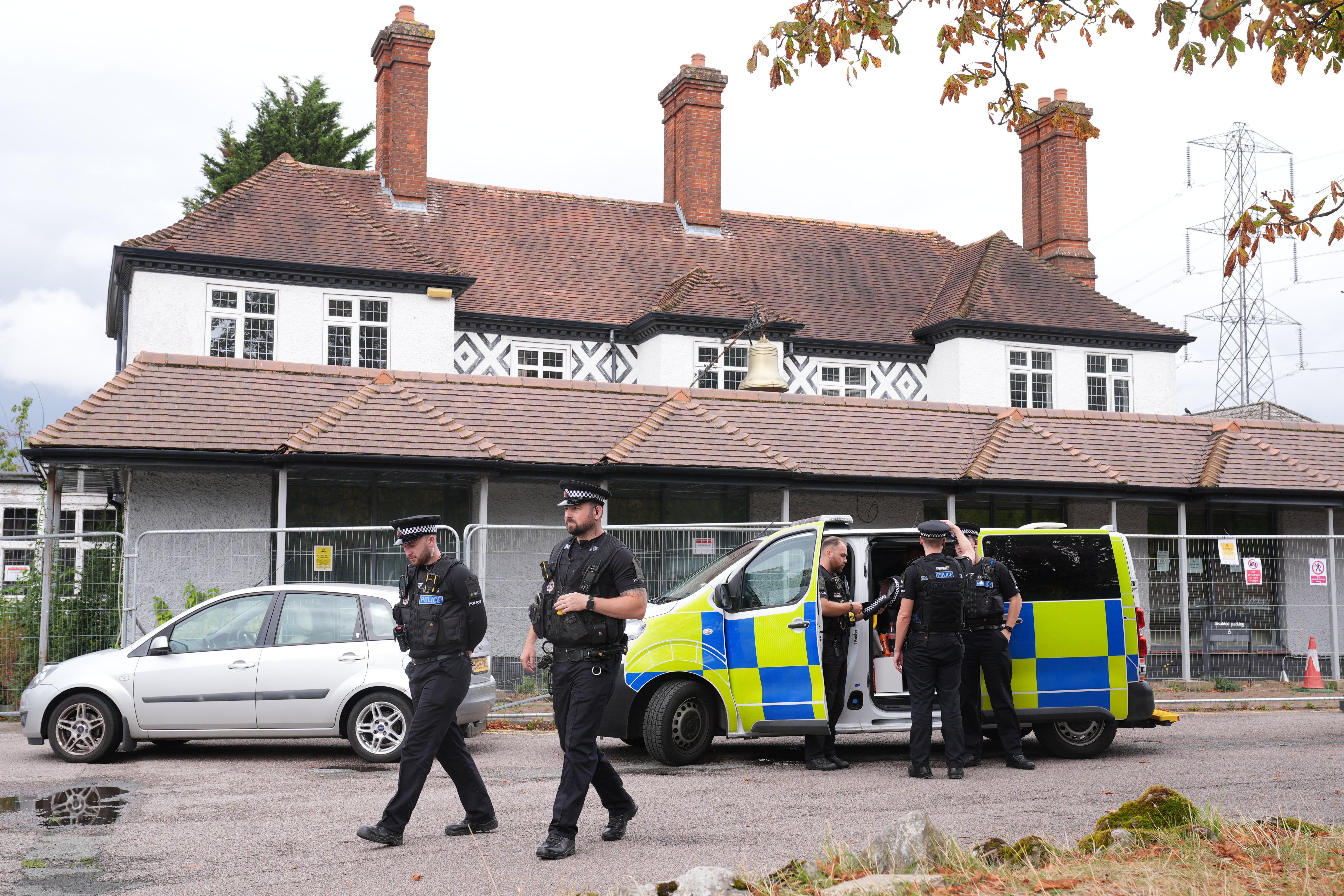 Police outside the Bell Hotel in Epping, where protests were held in the summer
