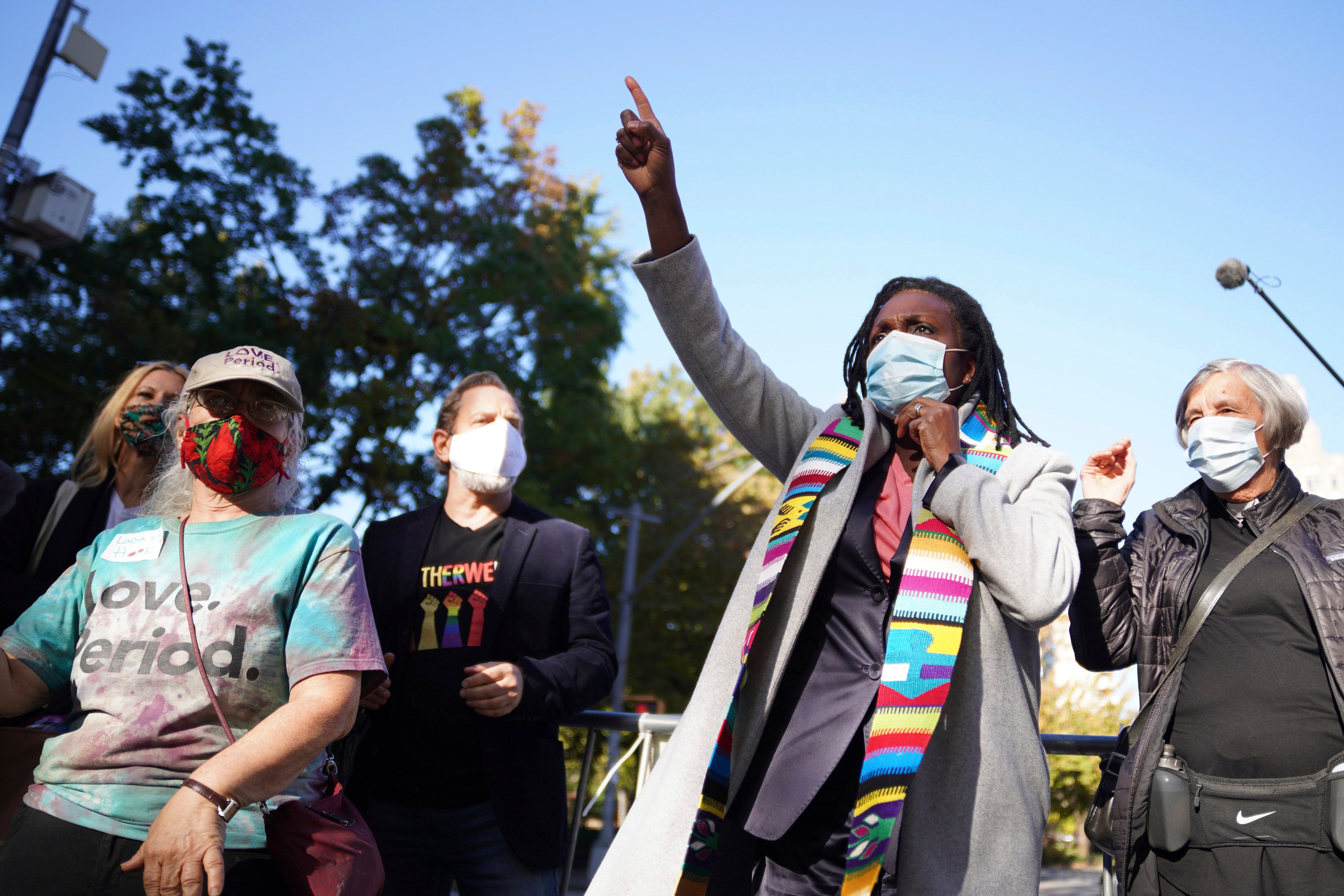 The Rev. Jacqui Lewis, senior pastor at Middle Collegiate Church, speaks during an interfaith gathering outside of the Judson Memorial Church near Washington Square Park in New York