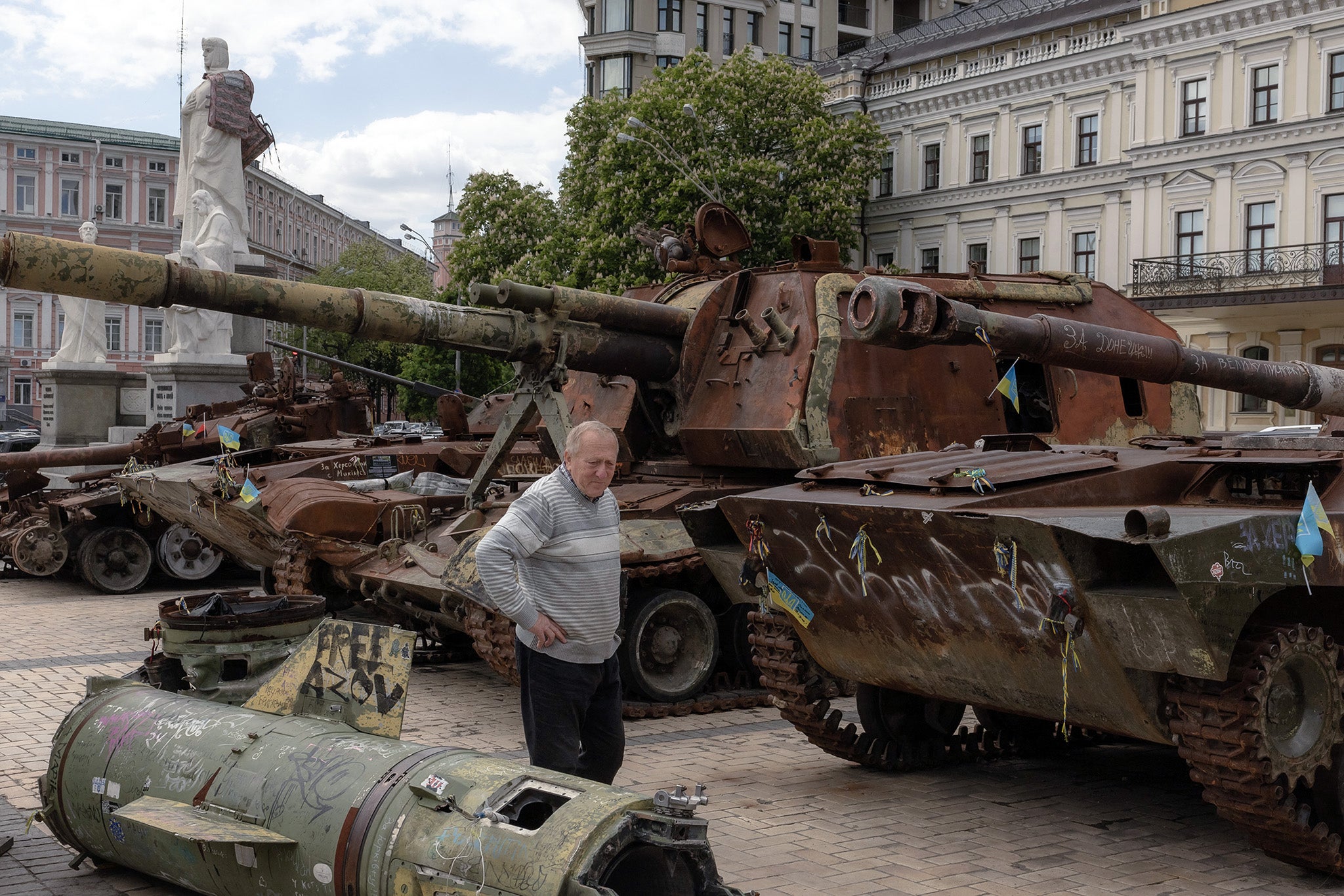 A local resident looks at destroyed Russian military vehicles displayed at St Michael’s Square in Kyiv earlier this year