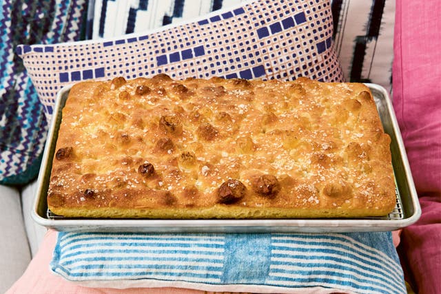 <p>Tall, golden and chewy – Nosrat’s sky-high focaccia is the result of years of tweaking and patience</p>