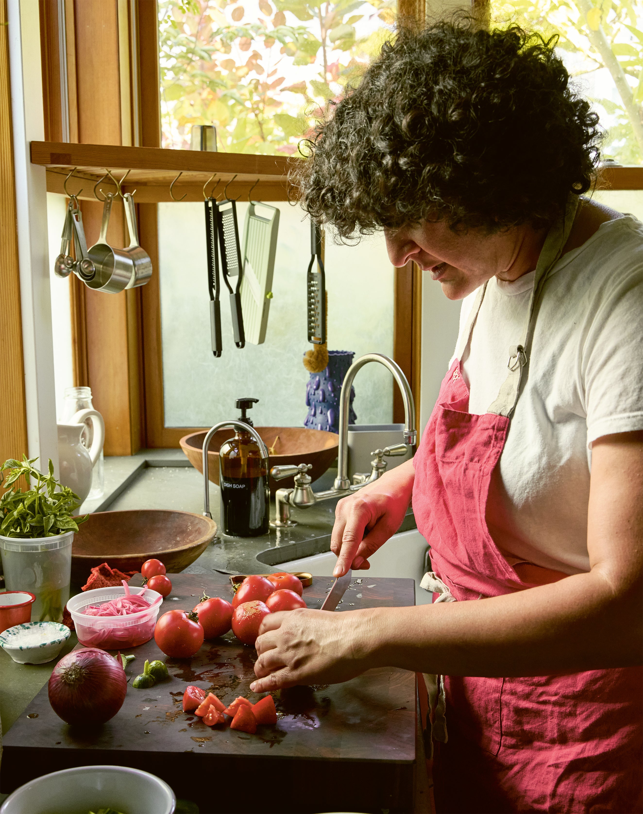 Cooking for pleasure, not perfection – Nosrat says even the simplest tasks, like slicing tomatoes, became her way back to joy