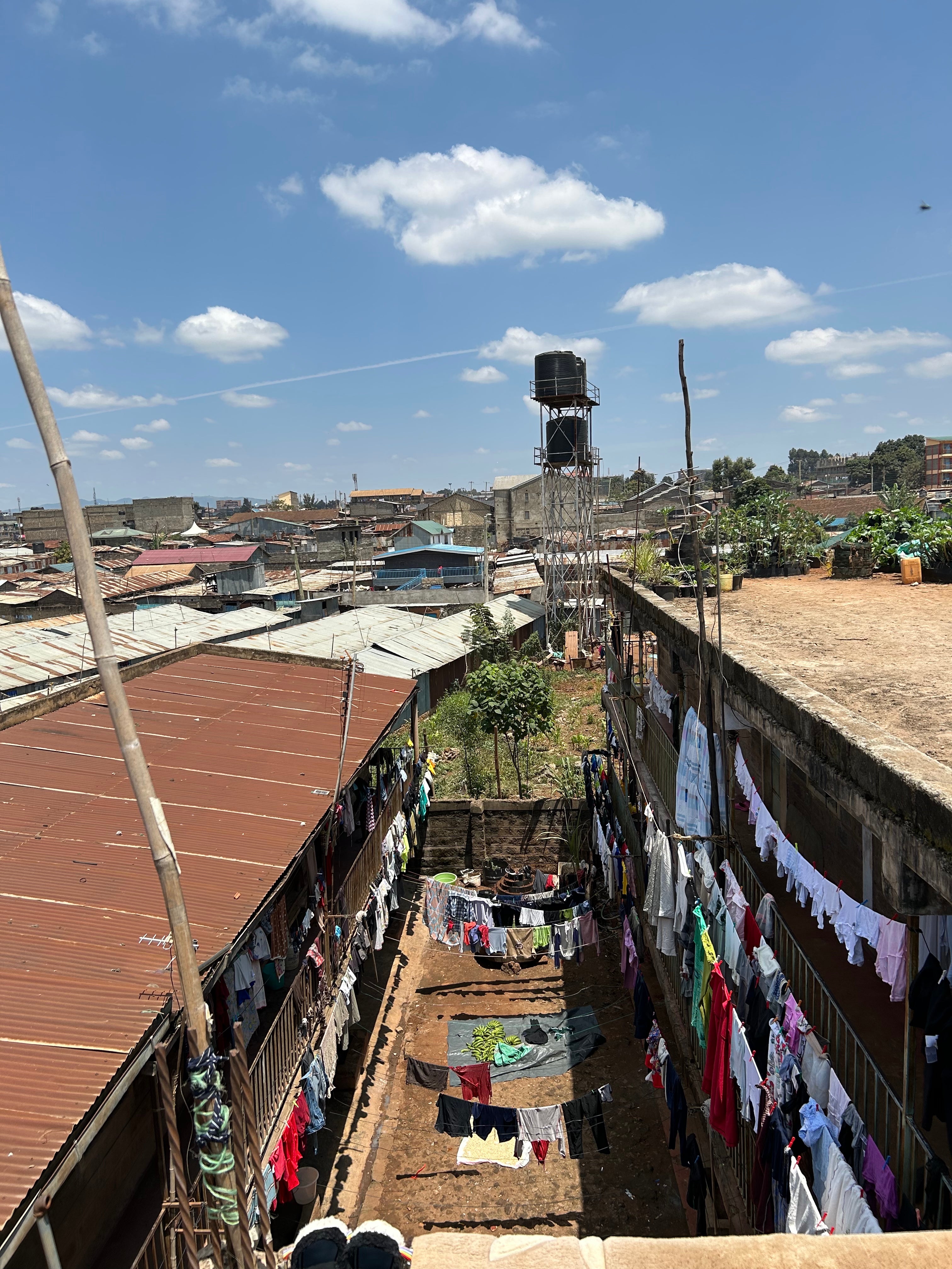 The vast number of colourful garments on display on laundry day give an indication of just how many people live in Jane’s block