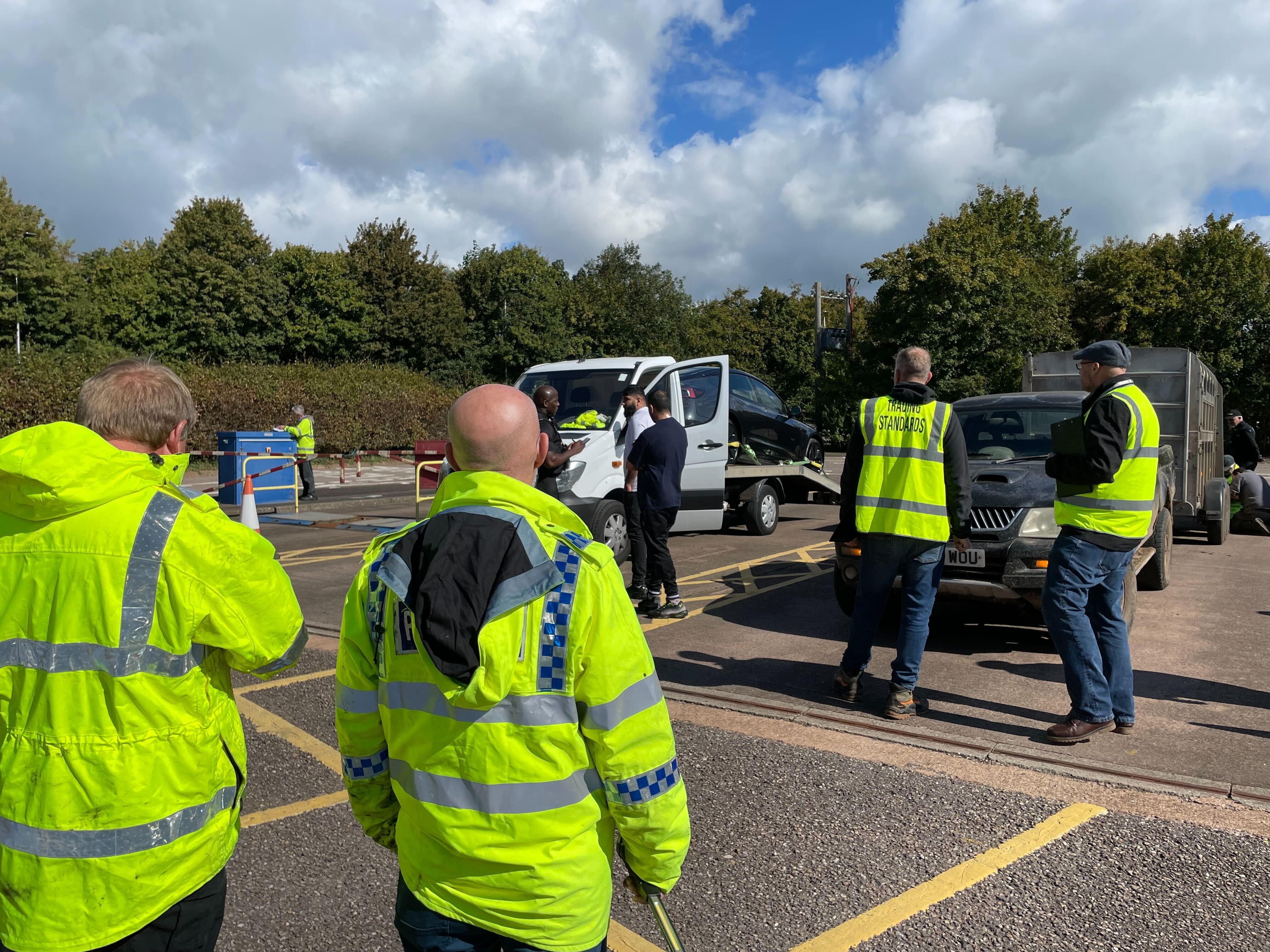 At a weighbridge facility near Tiverton, officers coordinating with the drone team pull vehicles over for checks