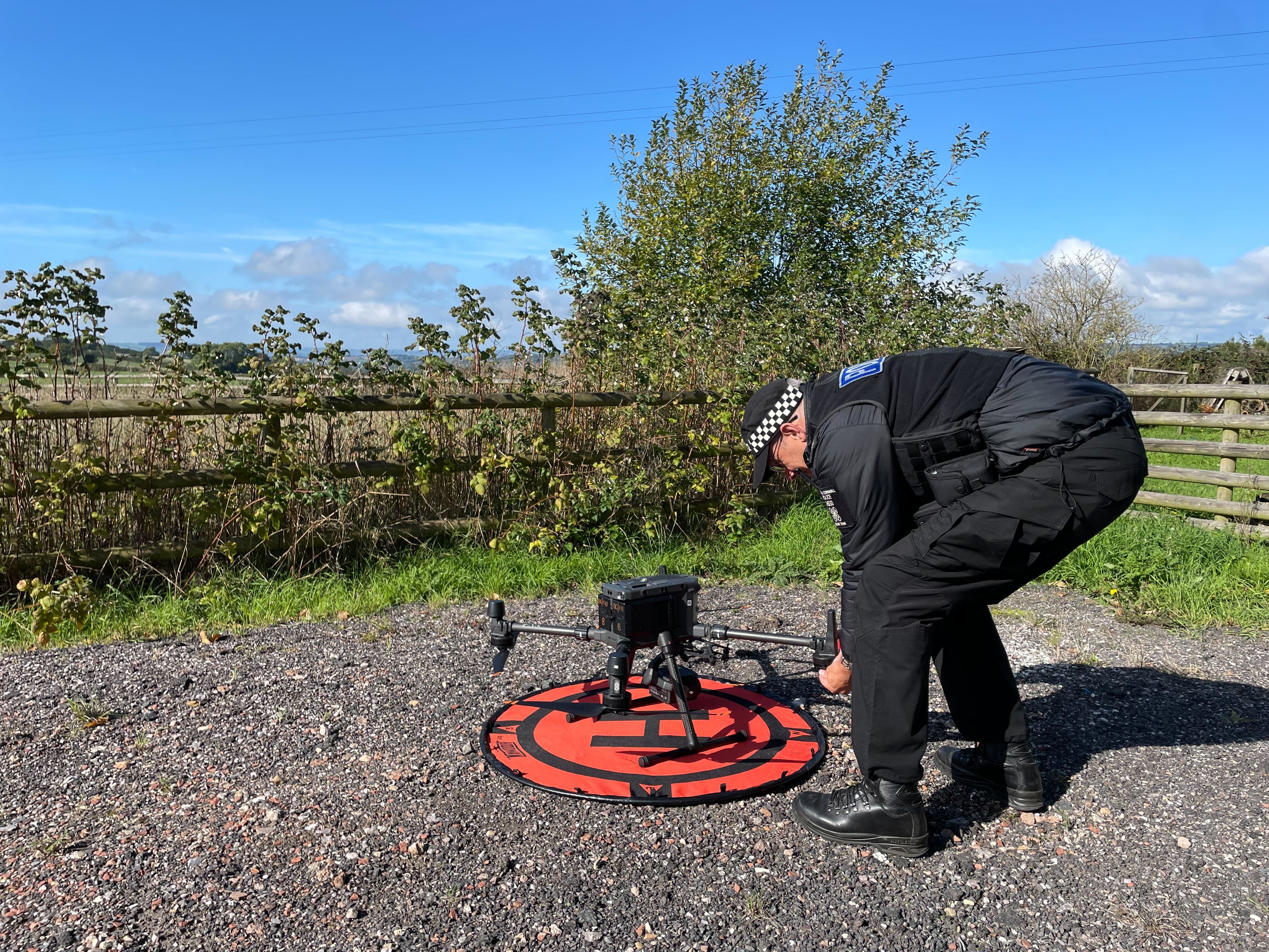 The drone takes off from a remote clearing not far from the M5 motorway