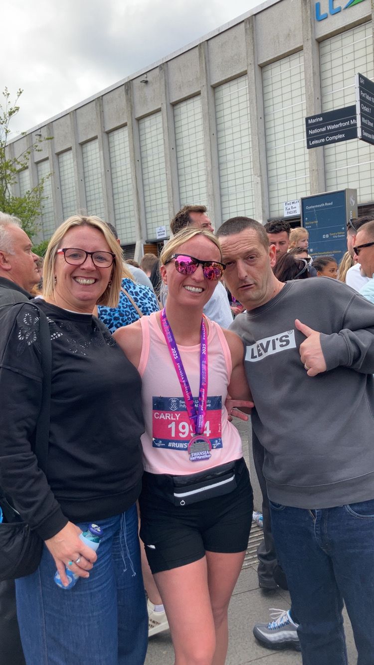 Carly Evans with her parents: ‘I knew how incredibly proud and happy my parents were to hear this news, and when I let myself feel that, I couldn’t hold back the tears’