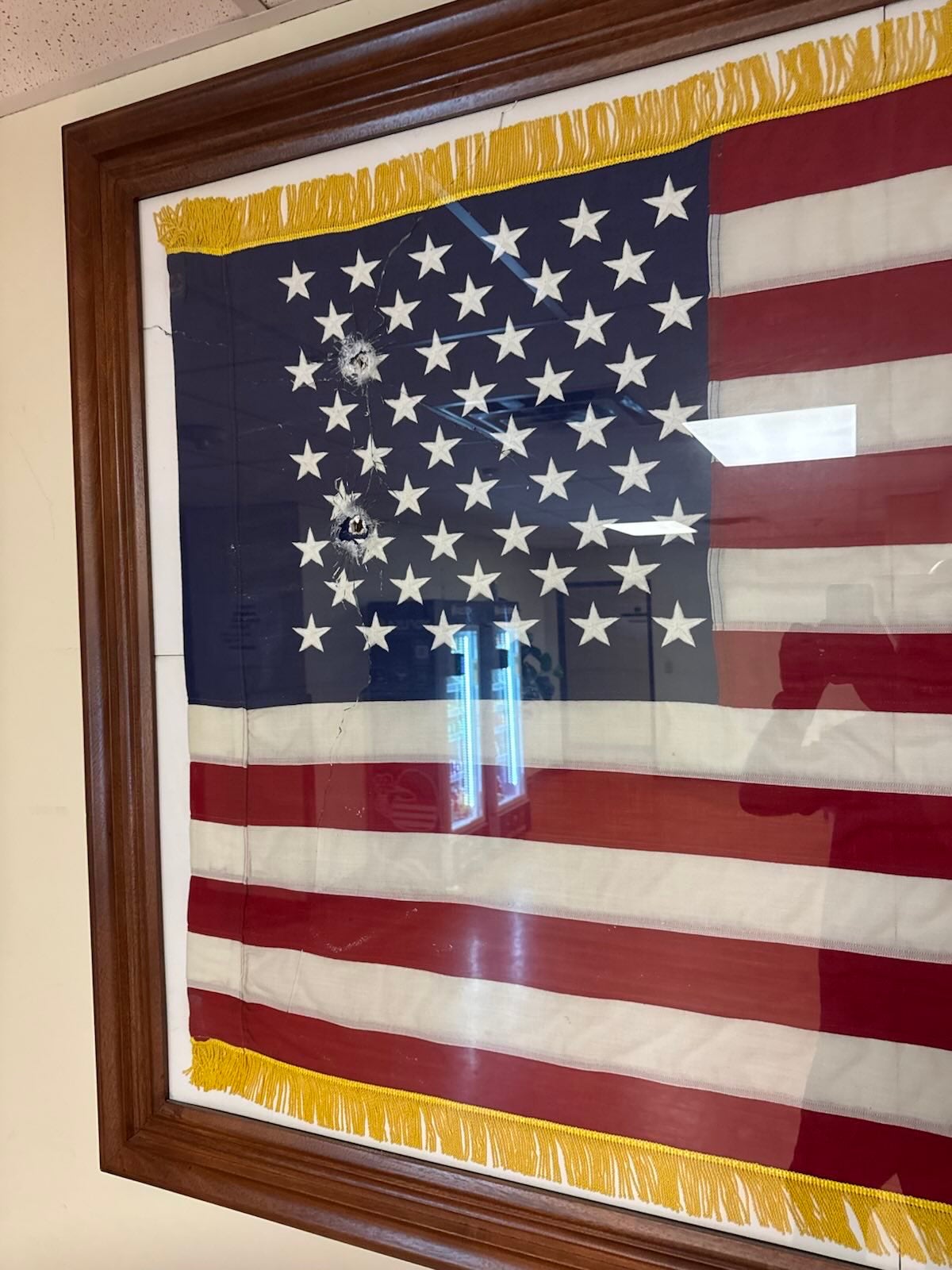 Tricia McLaughlin, the department’s spokeswoman, shared photos on social media of the bullet holes from inside the ICE facility