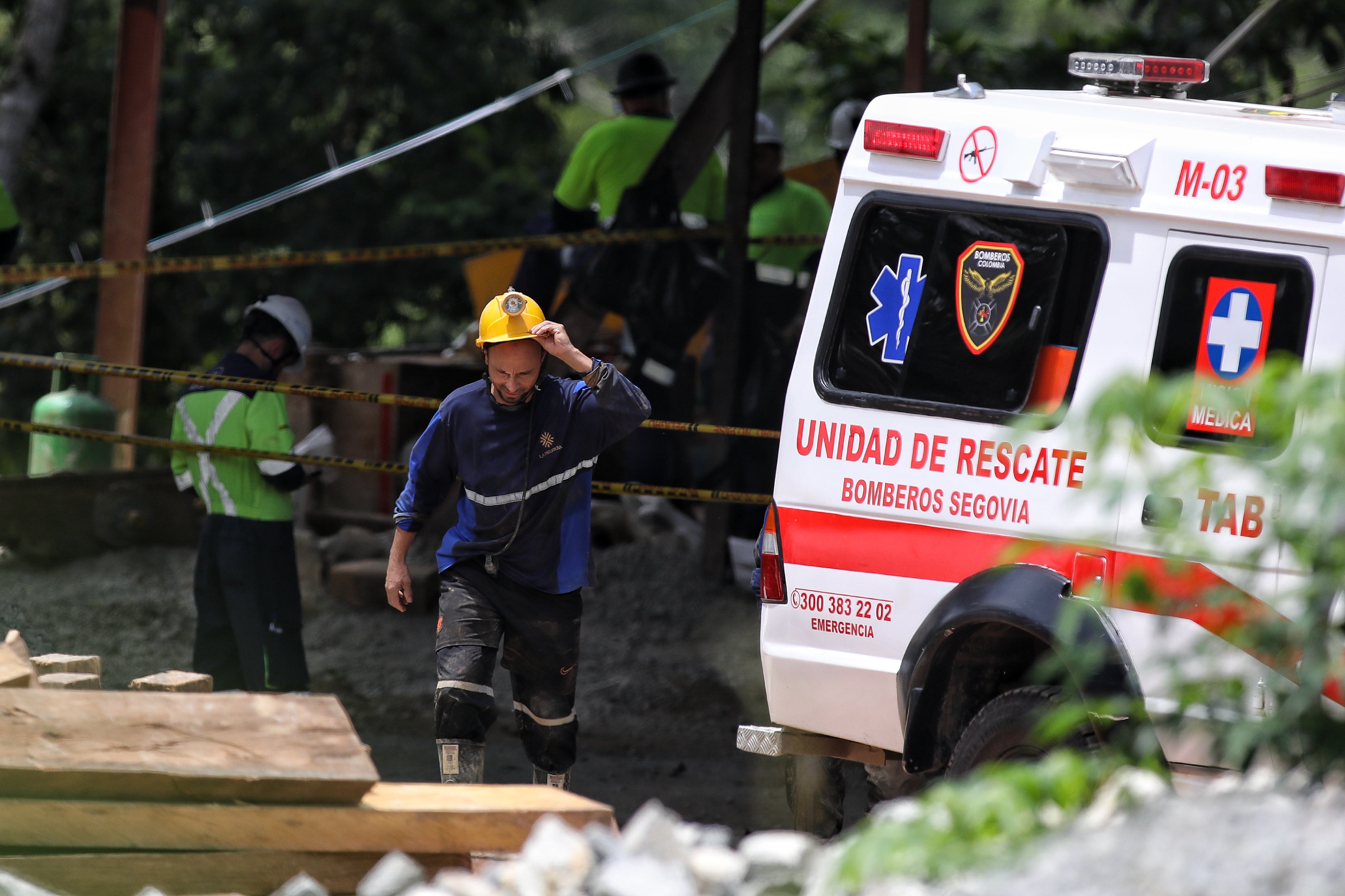 Red cross and firefighters work to rescue trapped miners after the gold mine they were working in collapsed, in Segovia, Colombia