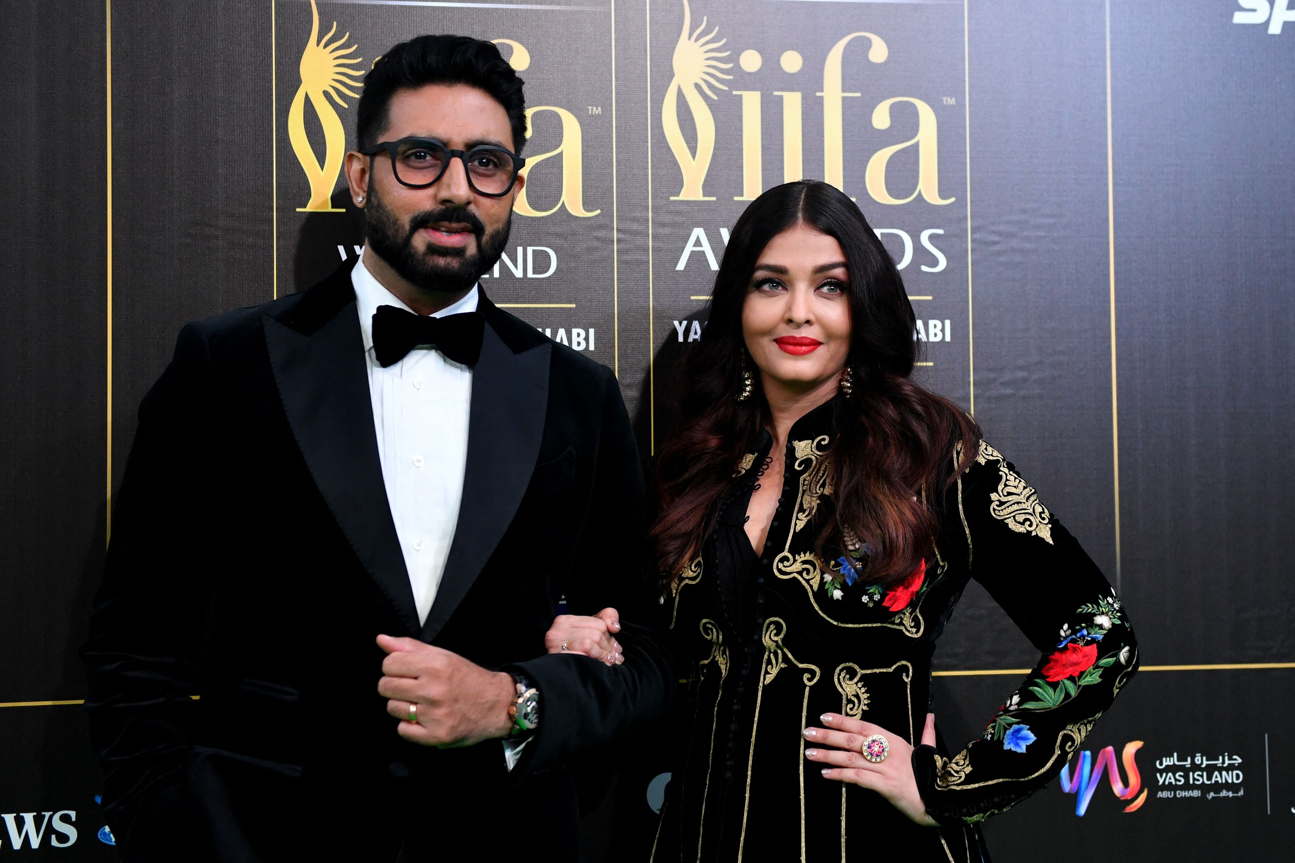 Indian celebrities Aishwarya Rai Bachchan (right), Abhishek Bachchan (left), and Karan Johar have gone to court to fight for their personality rights