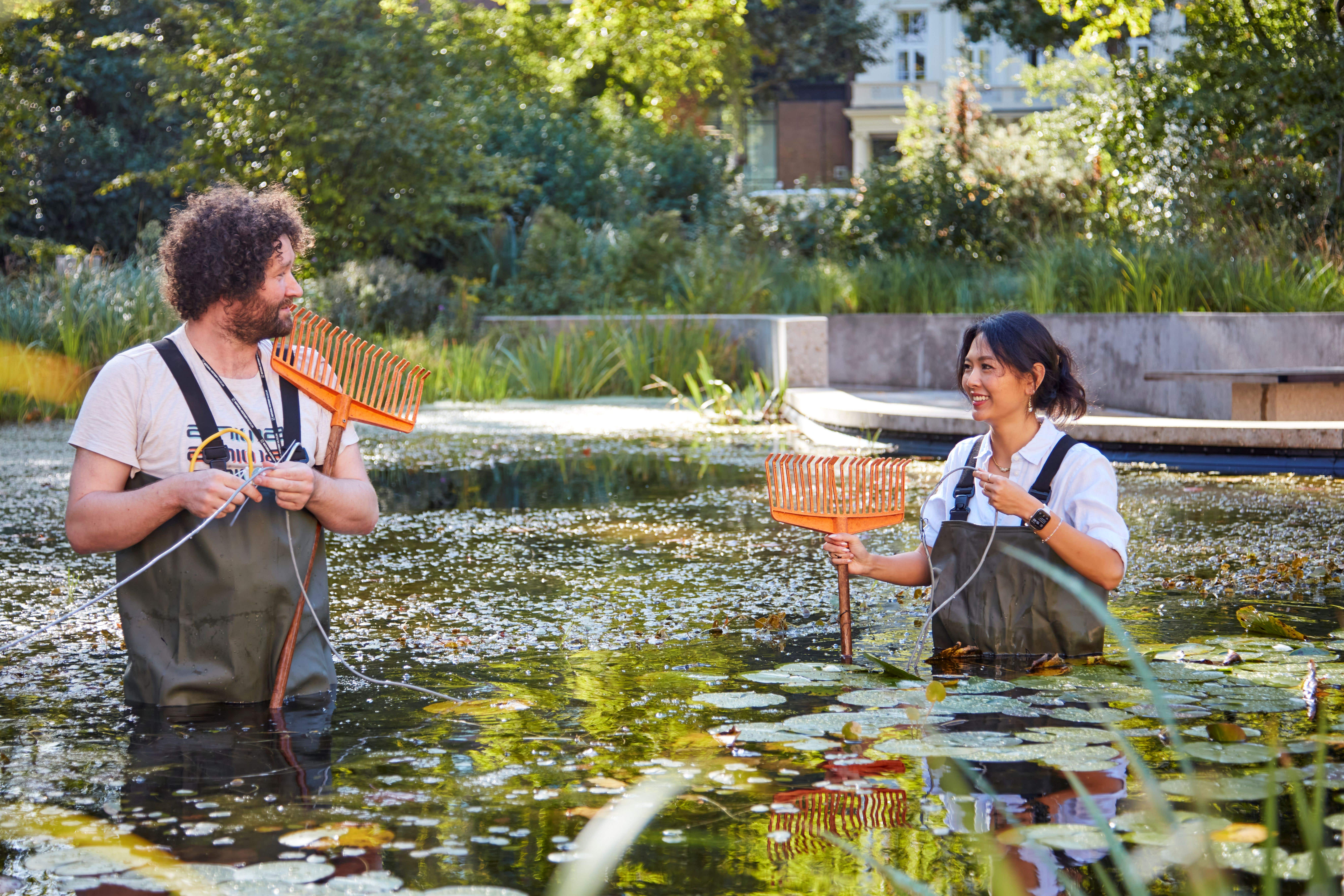 Ed Baker, acoustic biology researcher at the National History Museum and Hilary Tam, sustainability leader at Amazon Web Services, turning on the sensors (Trustees of the Natural History Museum/PA)